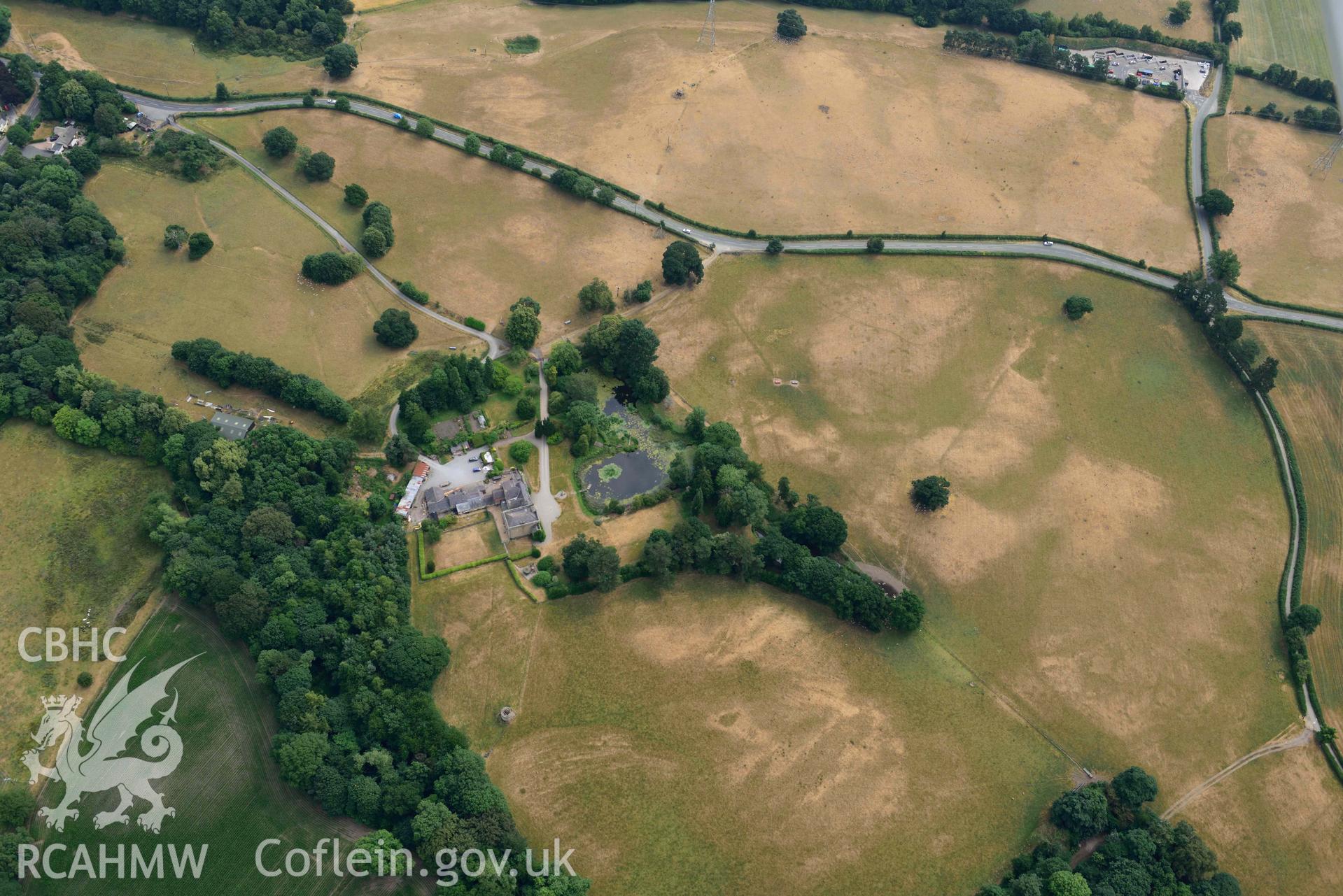 Cropmarks at Tower Garden, Mold. Oblique aerial photograph taken during the Royal Commission’s programme of archaeological aerial reconnaissance by Toby Driver on 10 July 2018.