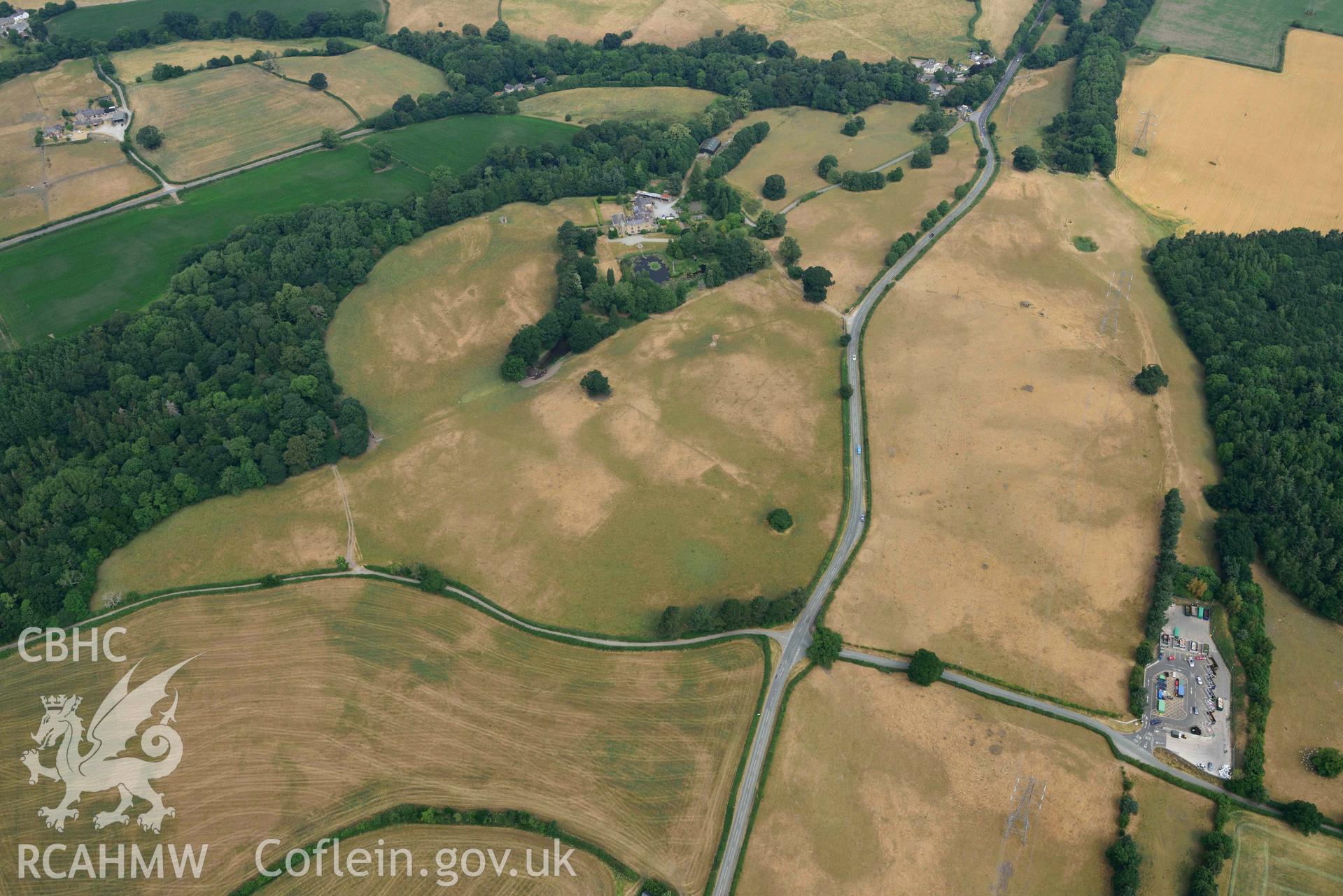 Cropmarks at Tower Garden, Mold. Oblique aerial photograph taken during the Royal Commission’s programme of archaeological aerial reconnaissance by Toby Driver on 10 July 2018.