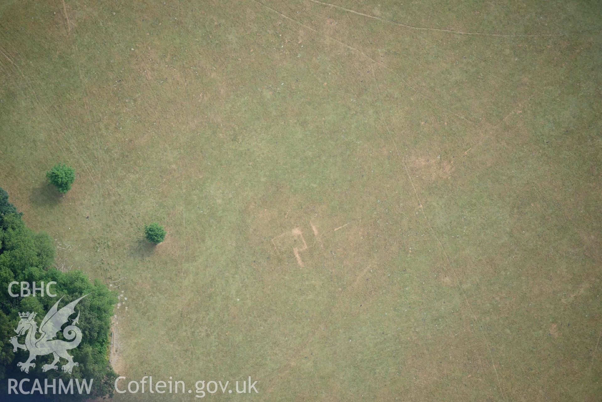 Parchmarks at Chirk Castle grounds. Oblique aerial photograph taken during the Royal Commission’s programme of archaeological aerial reconnaissance by Toby Driver on 10 July 2018.