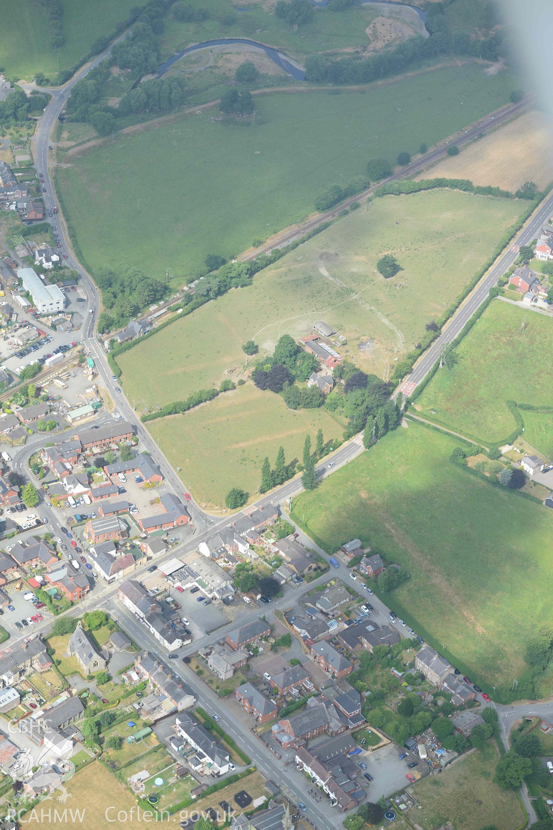 Caersws Roman Fort. Oblique aerial photograph taken during the Royal Commission’s programme of archaeological aerial reconnaissance by Toby Driver on 10 July 2018.