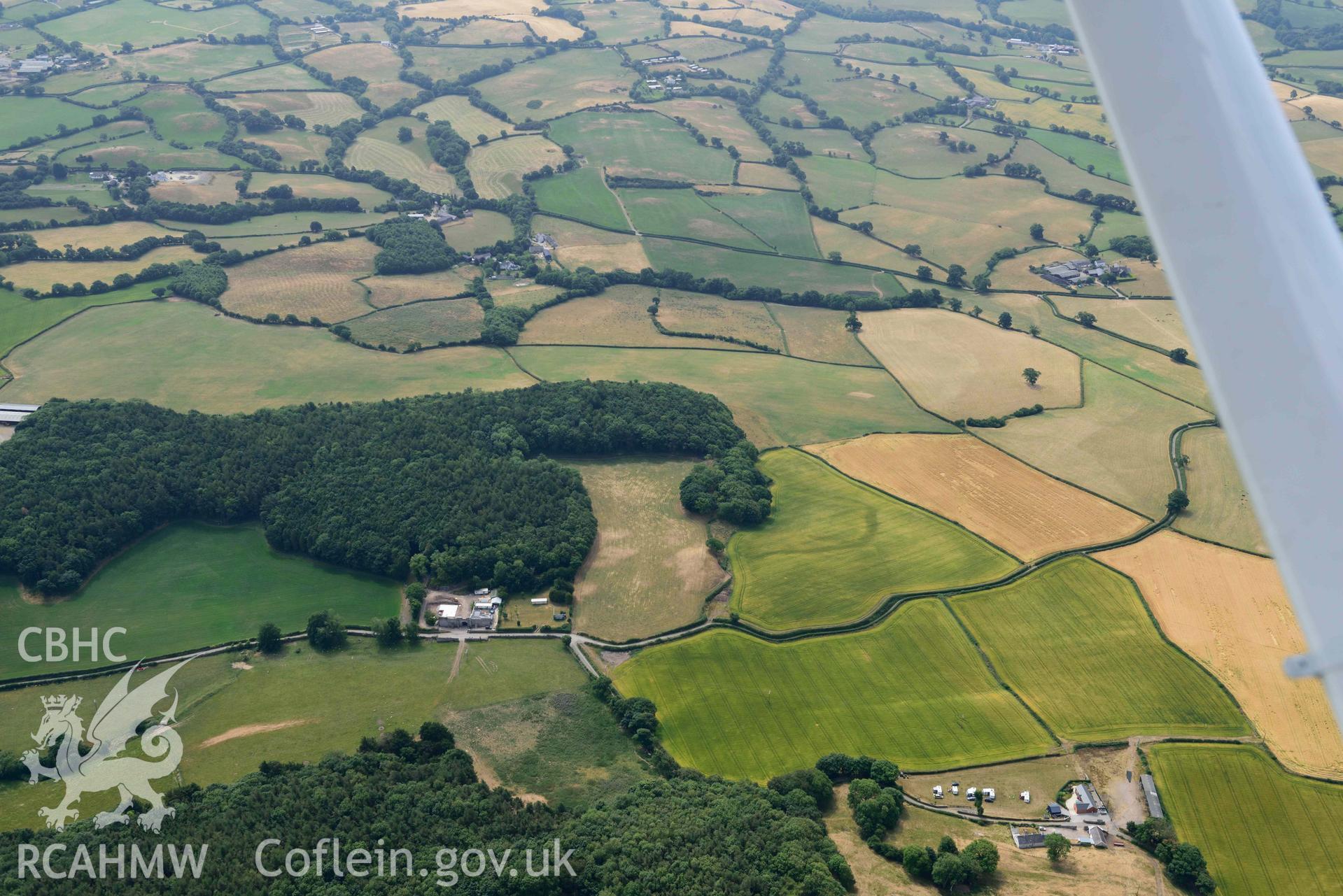 Betws Lodge cropmarks. Oblique aerial photograph taken during the Royal Commission’s programme of archaeological aerial reconnaissance by Toby Driver on 10 July 2018.