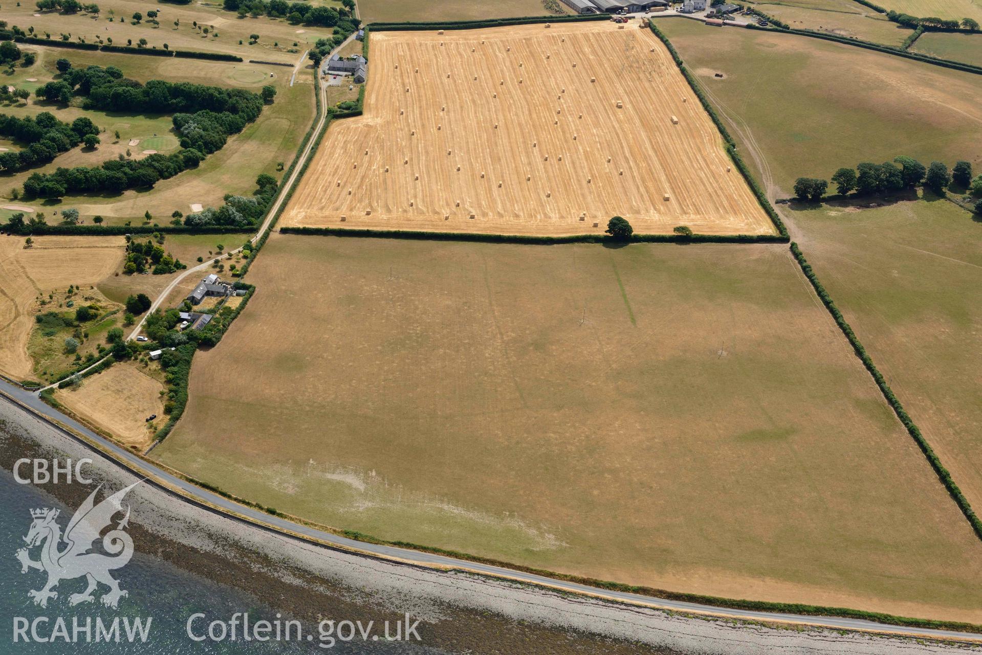 Plas Farm early field systems. Oblique aerial photograph taken during the Royal Commission’s programme of archaeological aerial reconnaissance by Toby Driver on 10 July 2018.