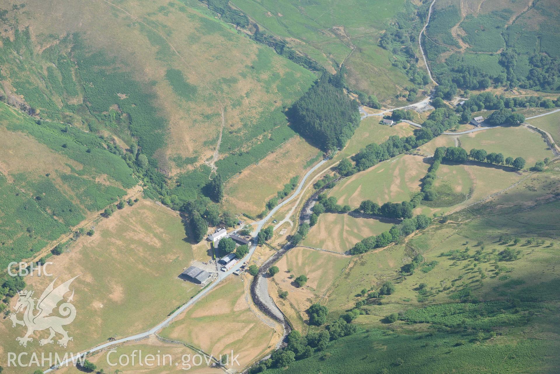 Valley parchmarks with Tyllwyd Cwmystwyth ring ditch and the site of Blaen Cwm chapel. Oblique aerial photograph taken during the Royal Commission’s programme of archaeological aerial reconnaissance by Toby Driver on 10 July 2018.
