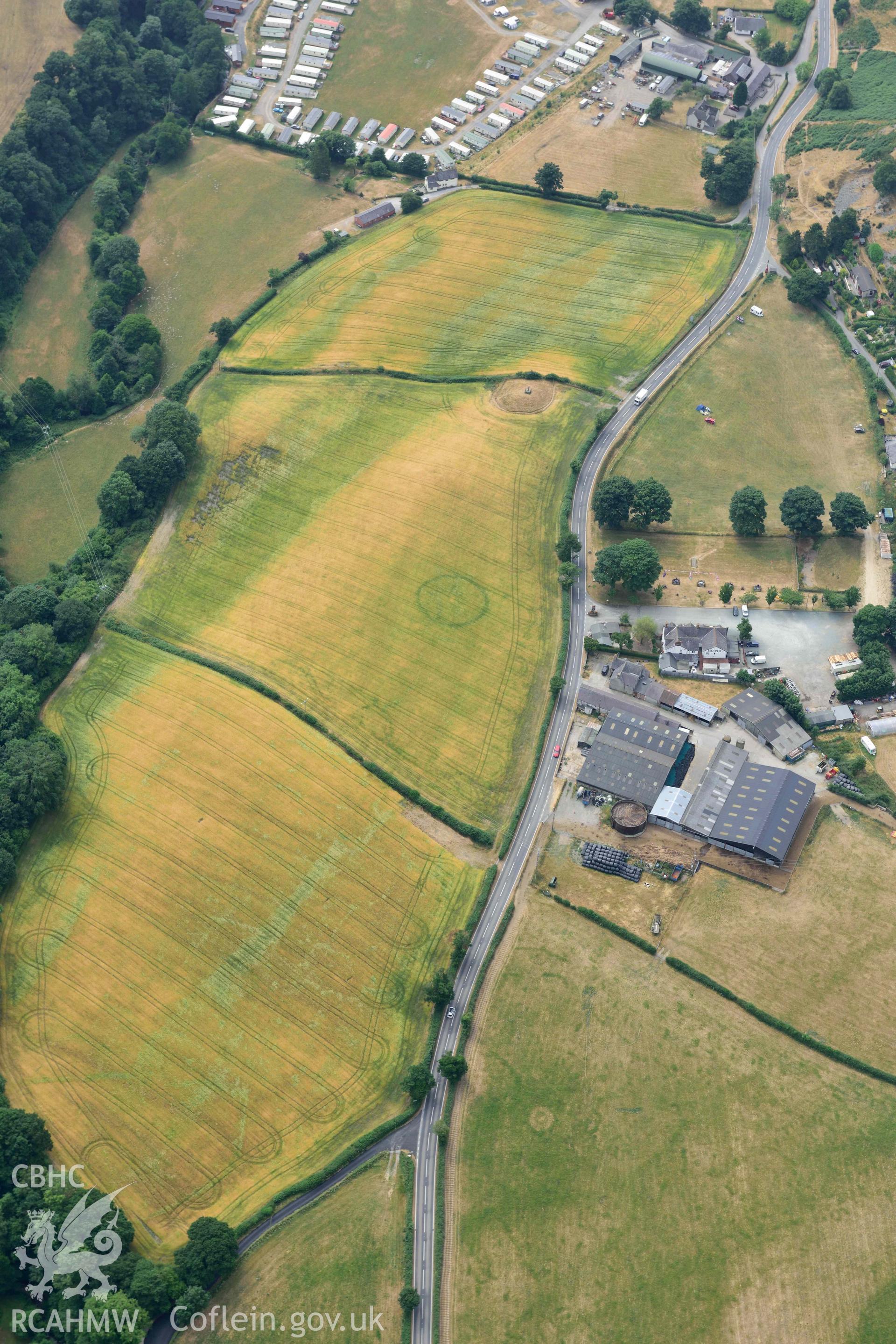 Maes y Llyn defended enclosure, Pillar of Eliseg and Eliseg Ring Ditch. Oblique aerial photograph taken during the Royal Commission’s programme of archaeological aerial reconnaissance by Toby Driver on 10 July 2018.