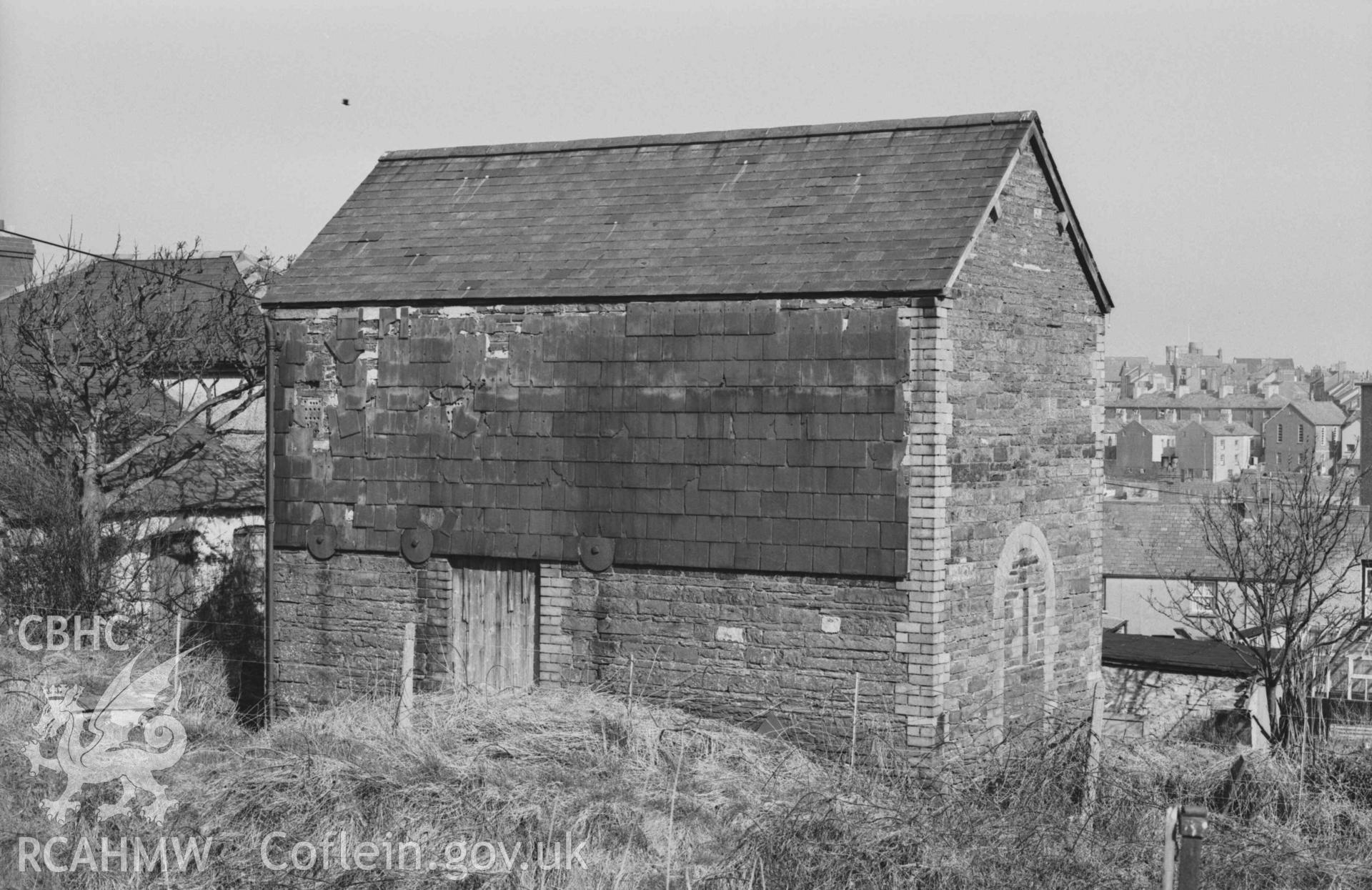 Digital copy of a black and white negative showing building on the north side of railway line 100m west south west of the railway bridge at the bottom of Penparcau Road, Aberystwyth. Photographed by Arthur Chater on 3 April 1969. Looking north north west from Grid Reference SN 58225 80990.
