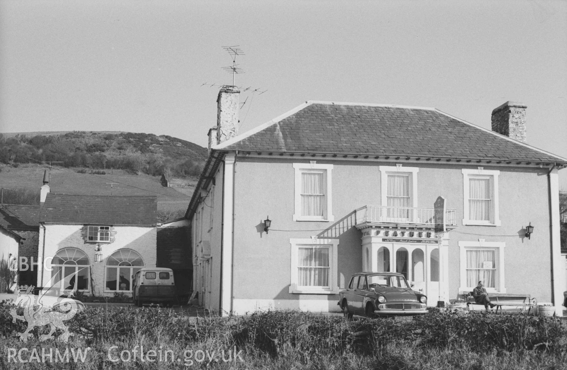 Digital copy of a black and white negative showing the Feathers Hotel, Alban Square, Aberaeron. Photographed by Arthur Chater on 3 April 1969. Looking south from Grid Reference SN 4600 6277.