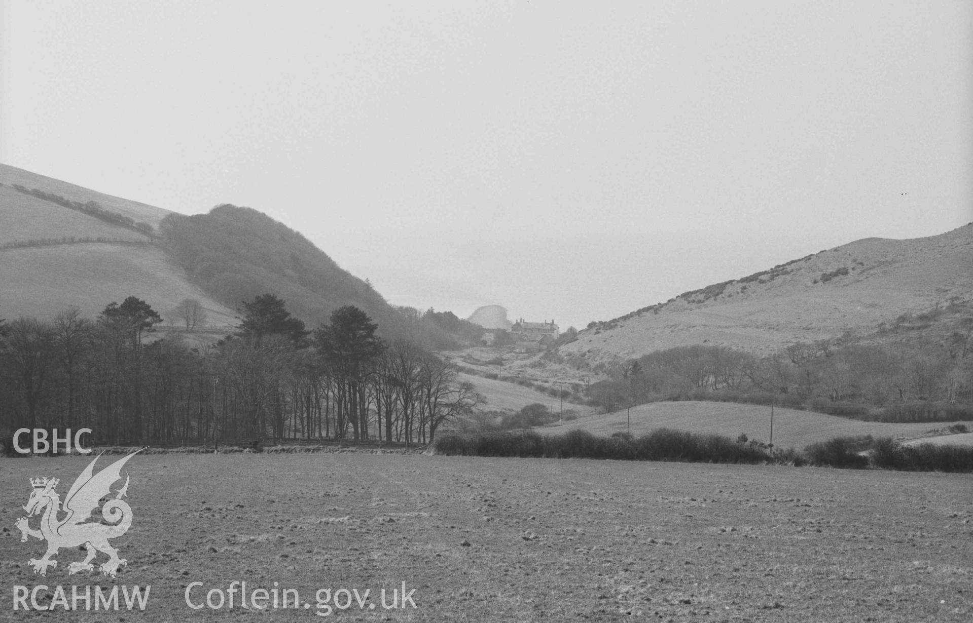 Digital copy of a black and white negative showing Sarn Cynfelyn from the road; 15:00hrs. Photographed by Arthur Chater on 4 April 1969. Looking west from Grid Reference SN 5994 8561.