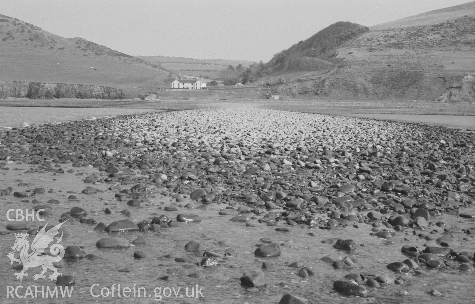 Digital copy of a black and white negative showing view to Wallog house from the extreme tip of Sarn Cynfelyn at lowest ebb of 29ft 7in tide; 15:45-15:55hrs. Photographed by Arthur Chater on 4 April 1969. Looking east from Grid Reference c. SN 584 858.