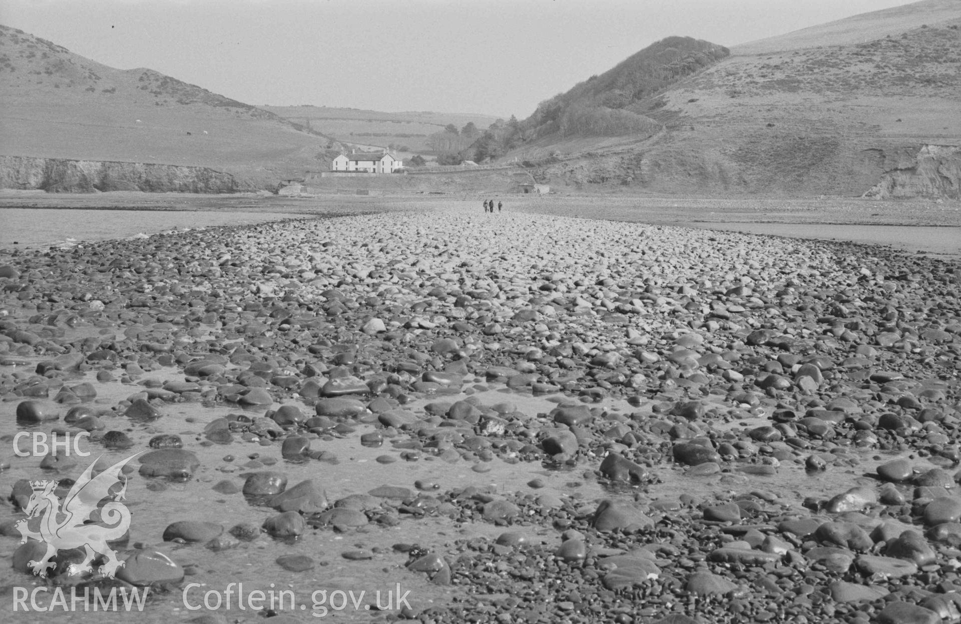 Digital copy of a black and white negative showing view to Wallog house from the extreme tip of Sarn Cynfelyn at lowest ebb of 29ft 7in tide; 15:45-15:55hrs. Photographed by Arthur Chater on 4 April 1969. Looking east from Grid Reference c. SN 584 858.