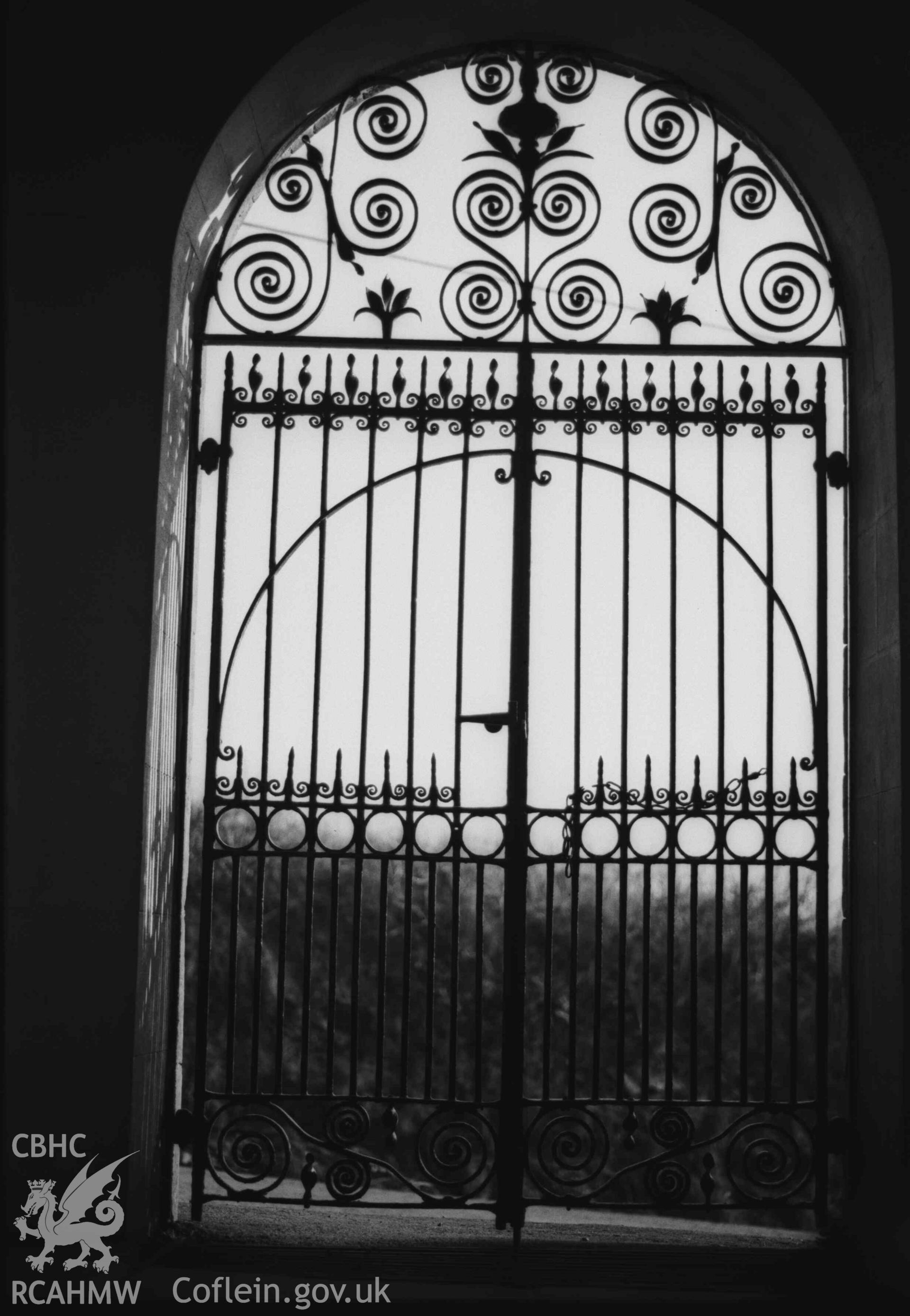 Digital copy of a black and white negative showing Troedyraur churchyard gates. Photographed by Arthur Chater on 5 April 1969. Looking south south west from Grid Reference SN 3270 4535.