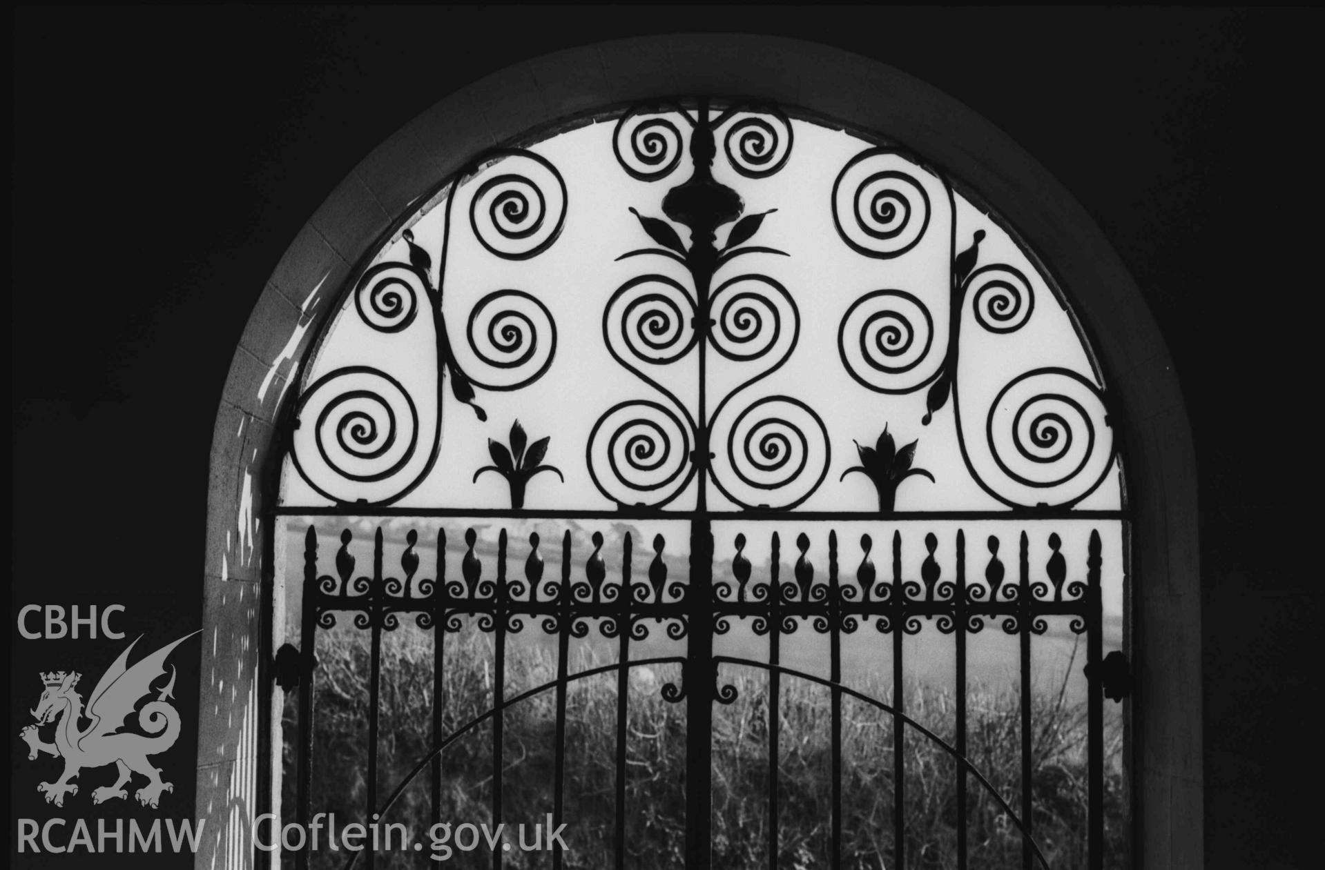 Digital copy of a black and white negative showing Troedyraur churchyard gates. Photographed by Arthur Chater on 5 April 1969. Looking south south west from Grid Reference SN 3270 4535.