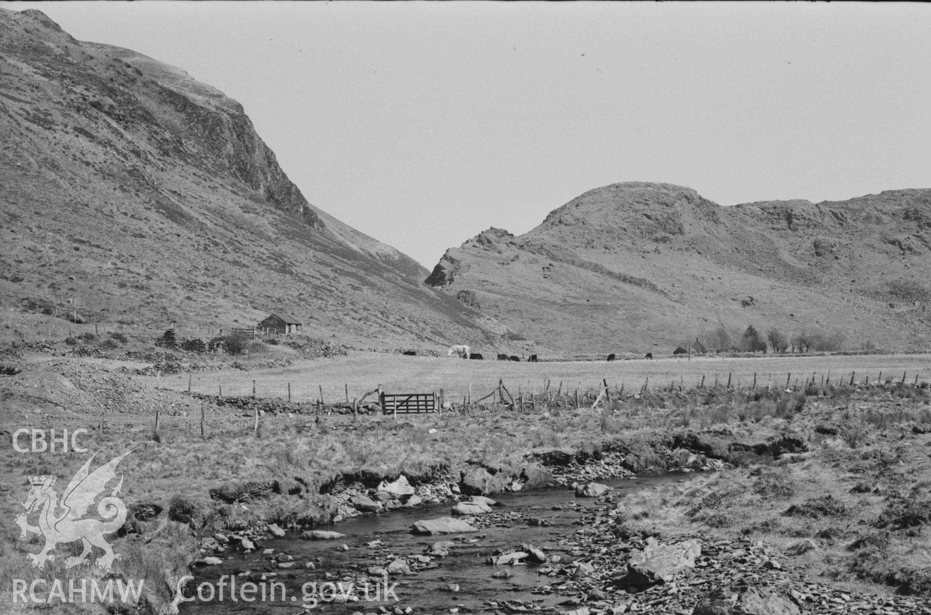 Digital copy of a black and white negative showing Llawr-y-Cwm-bach farm building. Photographed by Arthur Chater on 6 April 1969. From Grid Reference SN 7066 8530.