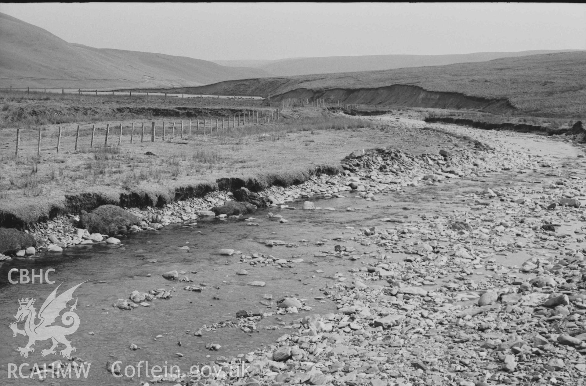 Digital copy of a black and white negative showing view from bridge over the Afon Claerwen downstream to the reservoir. Photographed by Arthur Chater on 8 April 1969. Looking south east from Grid Reference SN 8193 6717.
