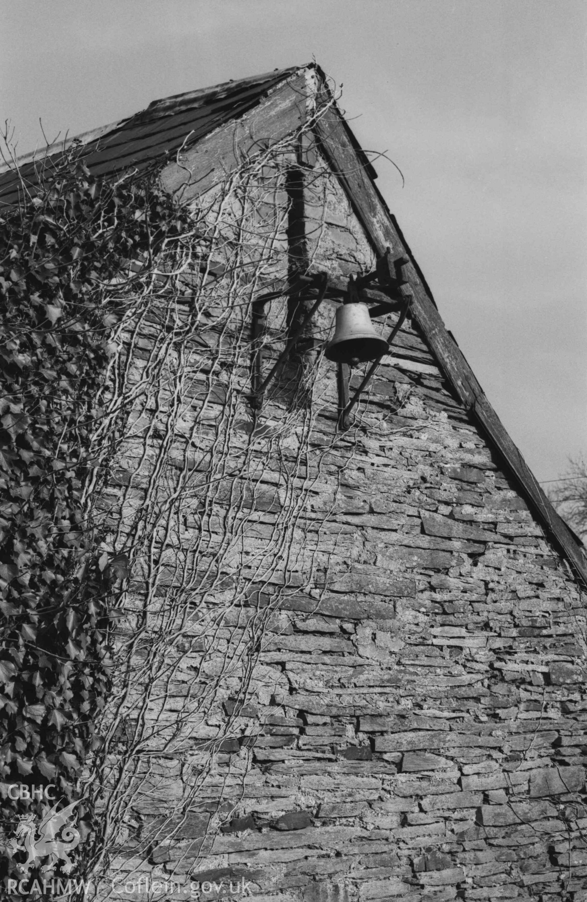 Digital copy of a black and white negative showing bell on the west end of the deserted Holy Cross Church. Photographed by Arthur Chater on 7 April 1969. Looking south east from Grid Reference SN 2186 4372.