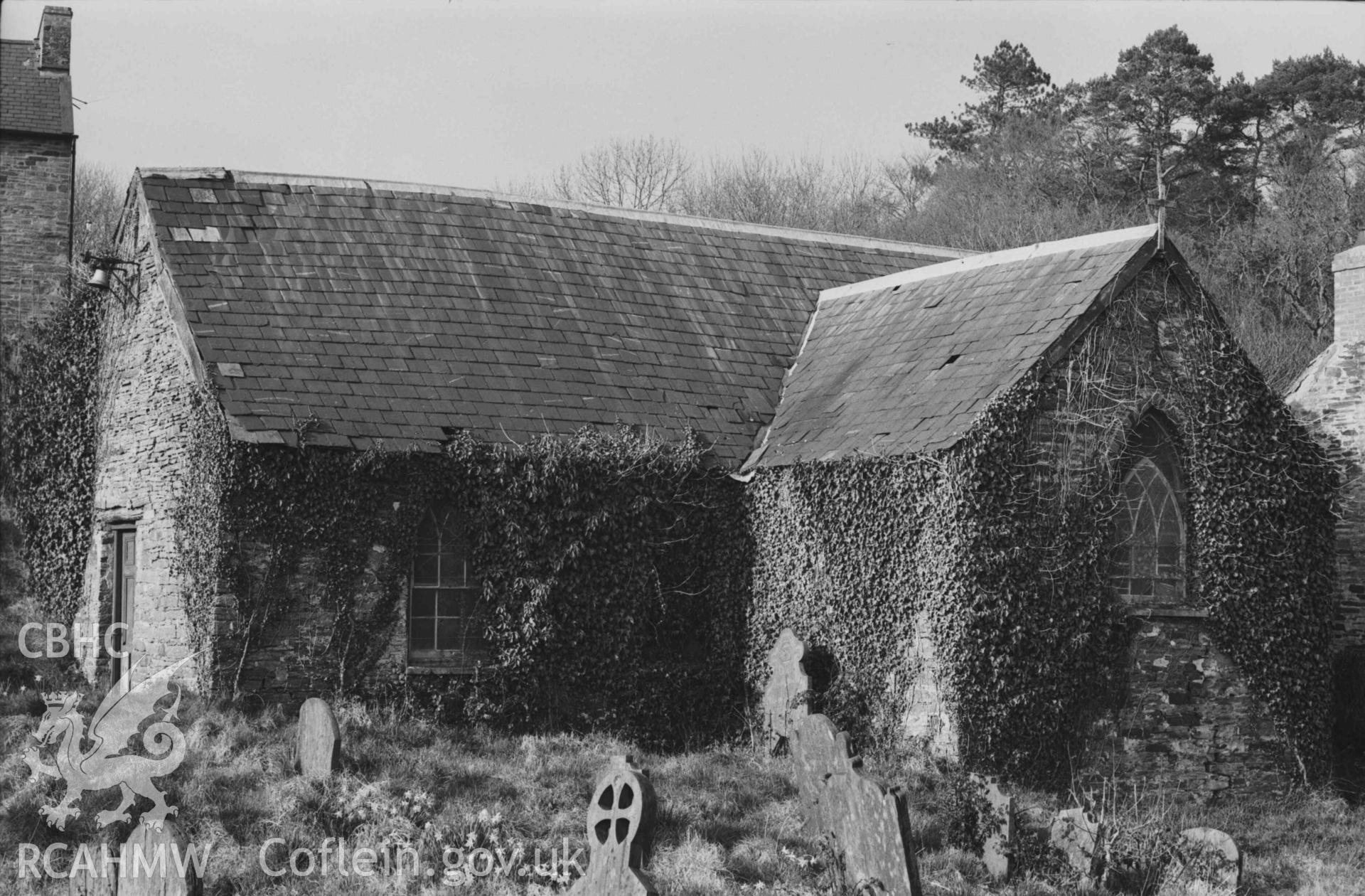 Digital copy of a black and white negative showing the deserted Holy Cross Church, showing the Coedmore chapel (south trancept) on the right. Photographed by Arthur Chater on 7 April 1969. Looking north east from Grid Reference SN 2186 4370.