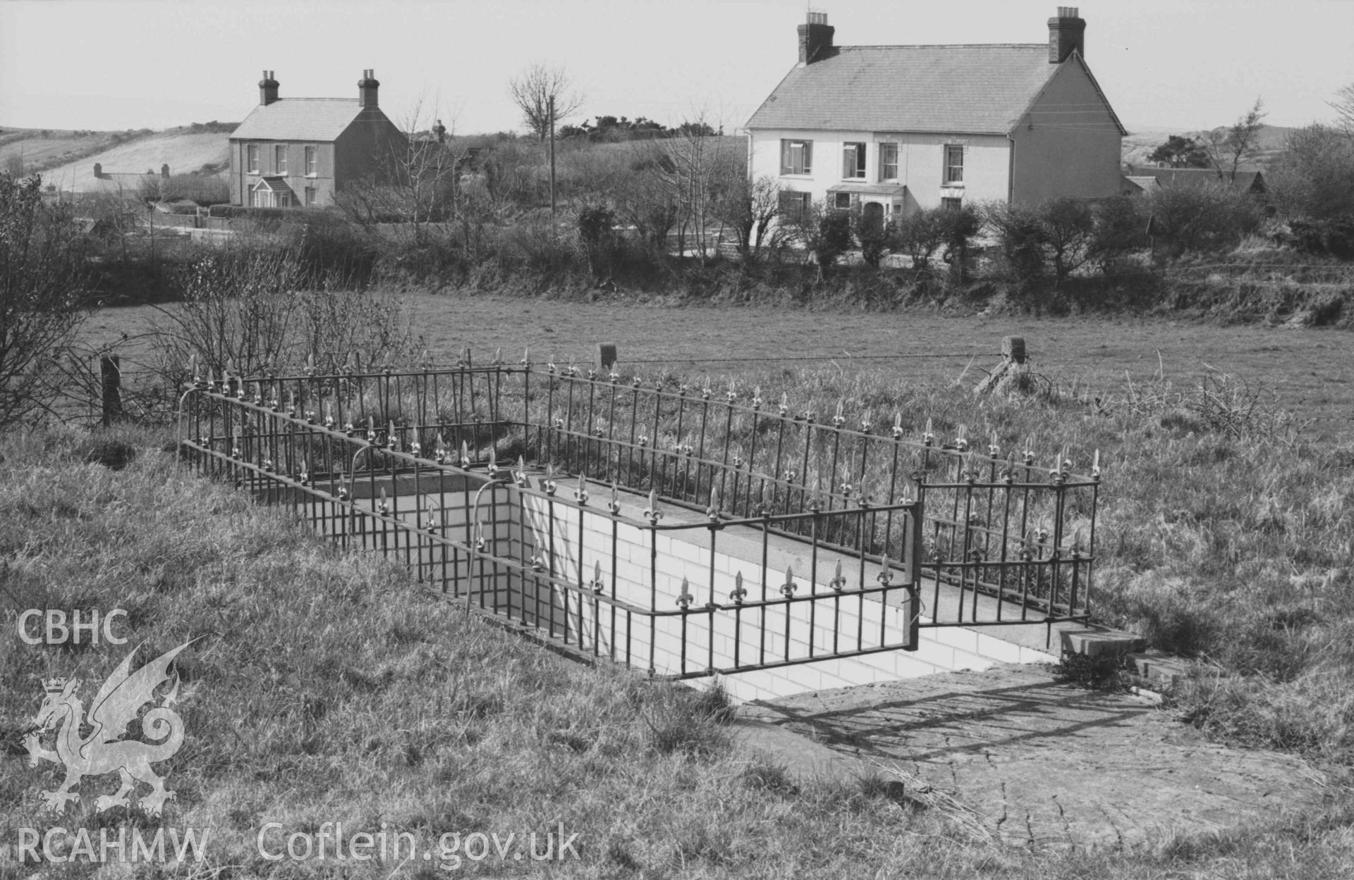 Digital copy of a black and white negative showing baptistry outside Capel Penyparc; Penpark Villa on the left. Photographed by Arthur Chater on 7 April 1969. Looking west from Grid Reference SN 2118 4789.