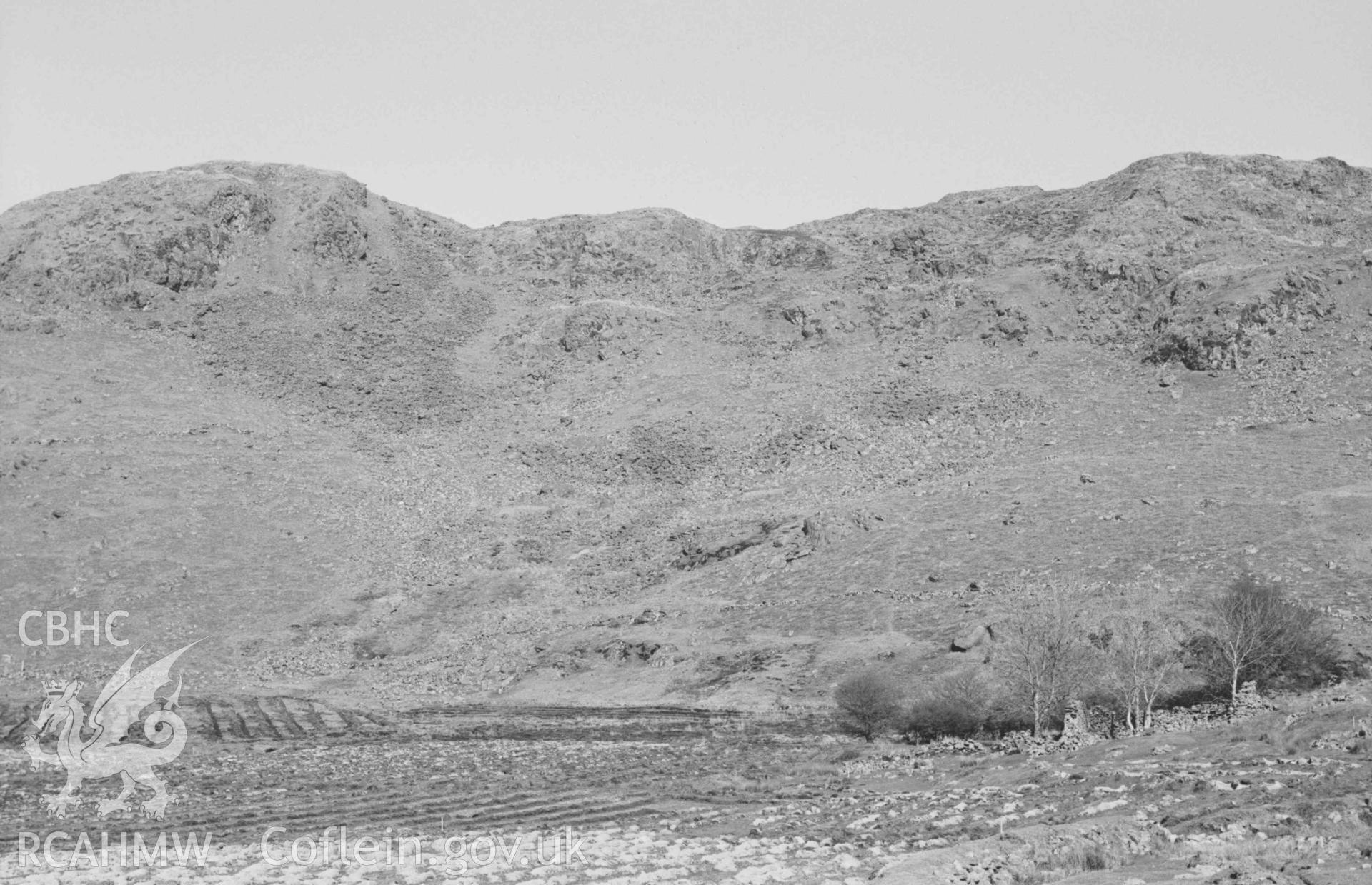 Digital copy of a black and white negative showing Banc Lletty-Evan-Hen (Graig Wen) and ruin (right) 200m south south east of Llawr-y-cwm-mawr. Photographed by Arthur Chater on 6 April 1969. Looking east north east from Grid Reference SN 7117 8513.