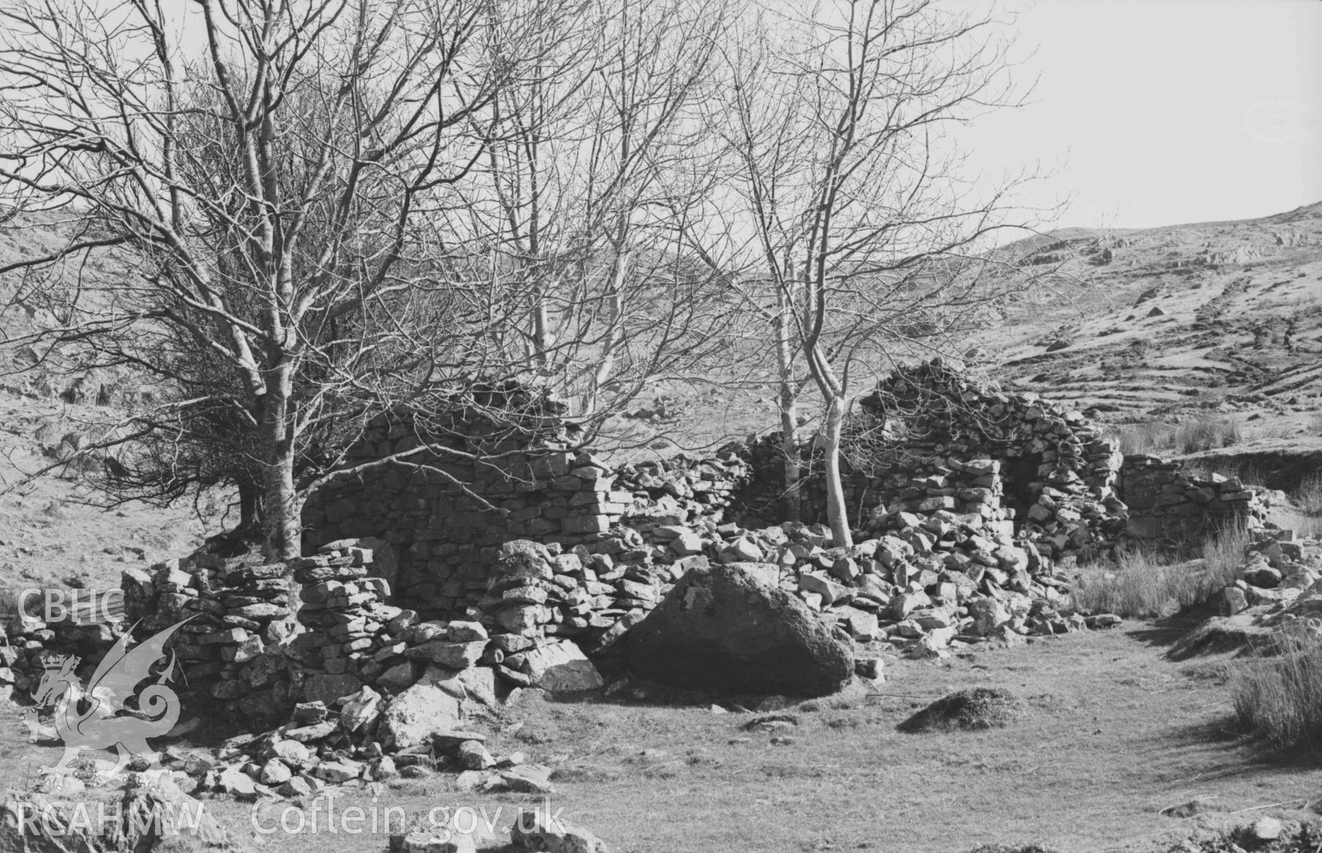 Digital copy of a black and white negative showing ruin 200m south south east of Llawr-y-cwm-mawr. Photographed by Arthur Chater on 6 April 1969. Looking south east from Grid Reference SN 7128 8517.