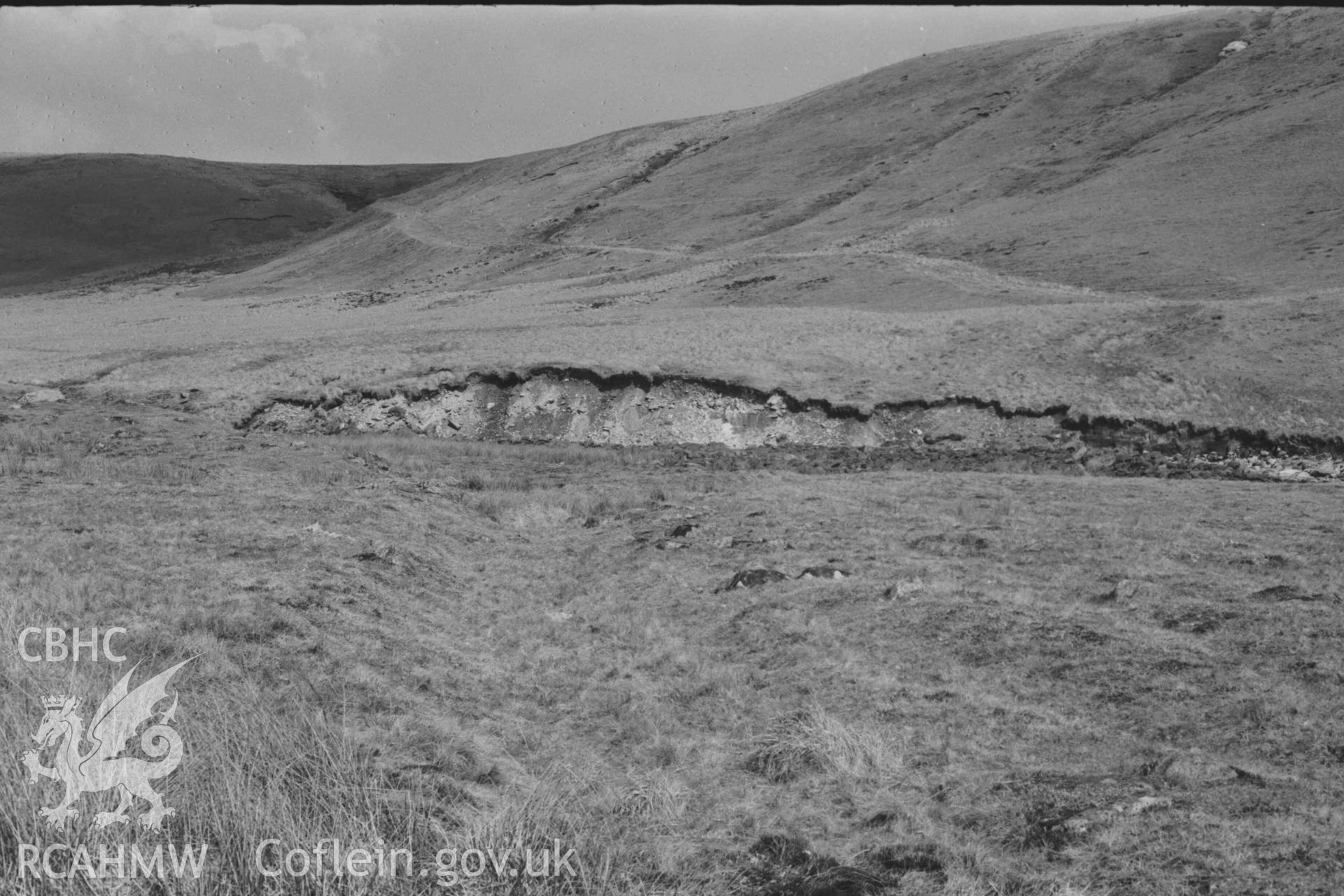 Digital copy of a black and white negative showing view along the old road to Rhyd Hengae (and Cnapyn Blaen-Drawsffos in Radnorshire). Photographed by Arthur Chater on 8 April 1969. Looking north east from Grid Reference SN 8229 6817.
