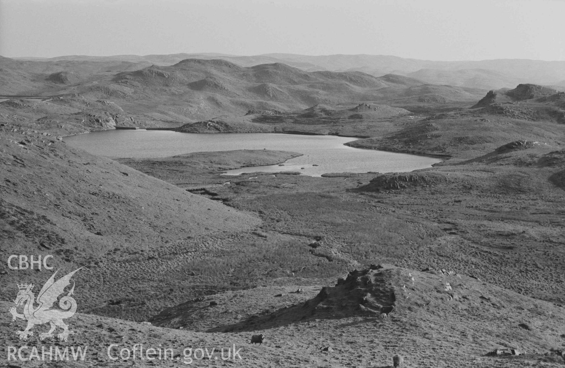 Digital copy of a black and white negative showing westernmost lake of the Teifi Pools from 350m north by the road. Photographed by Arthur Chater on 8 April 1969. Looking south from Grid Reference SN 7780 6820.