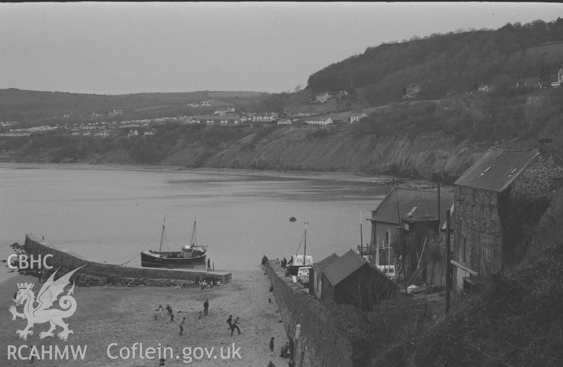 Digital copy of a black and white negative showing lifeboat station and stone breakwater from the south end of South John Street. Photographed by Arthur Chater on 9 April 1969. Looking south east from Grid Reference SN 3898 5995.