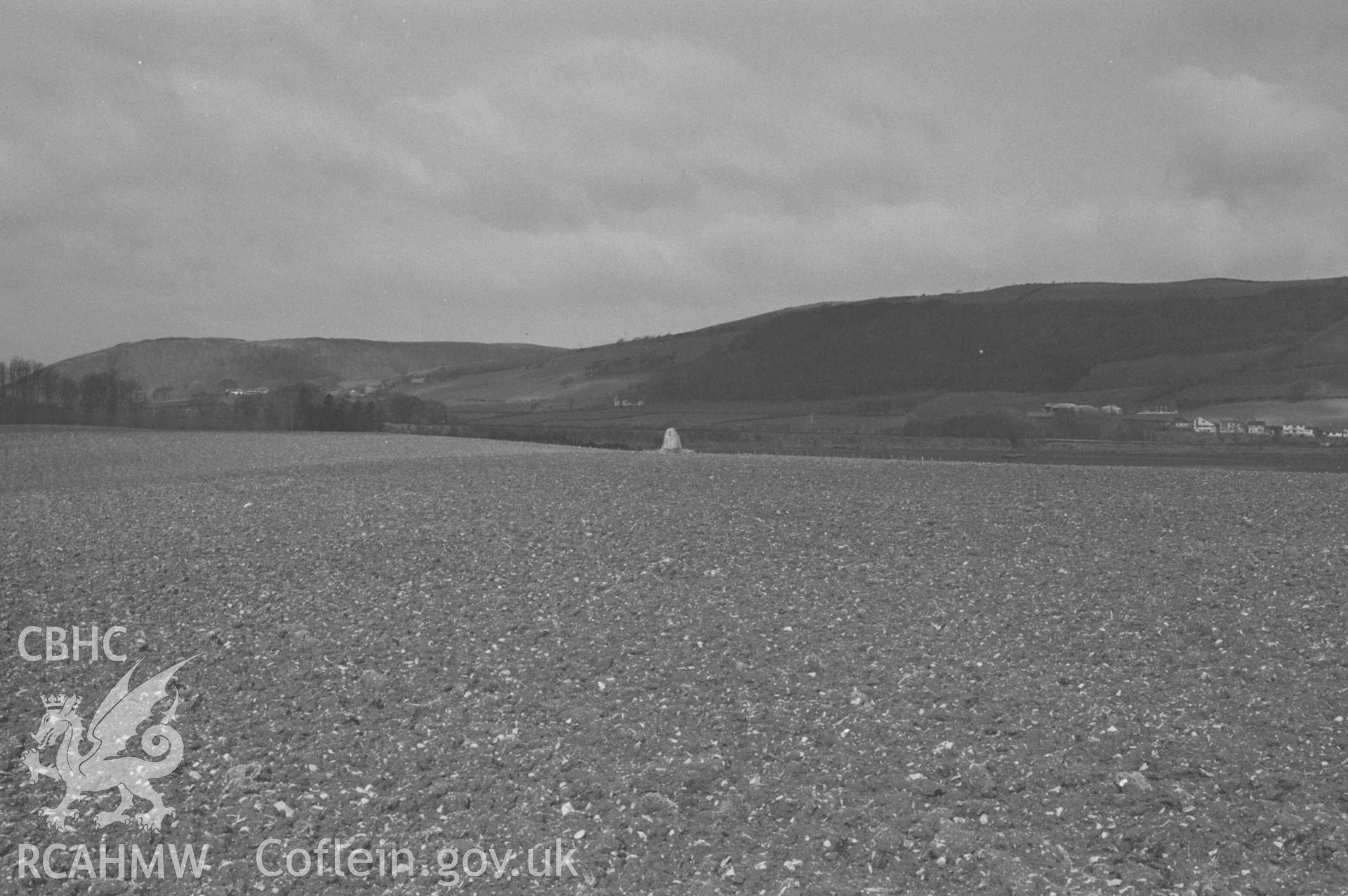 Digital copy of a black and white negative showing standing stone in field 450m west south west of Plas Gogerddan. Photographed by Arthur Chater on 12 April 1969. Looking west north west from Grid Reference SN 6260 8350.