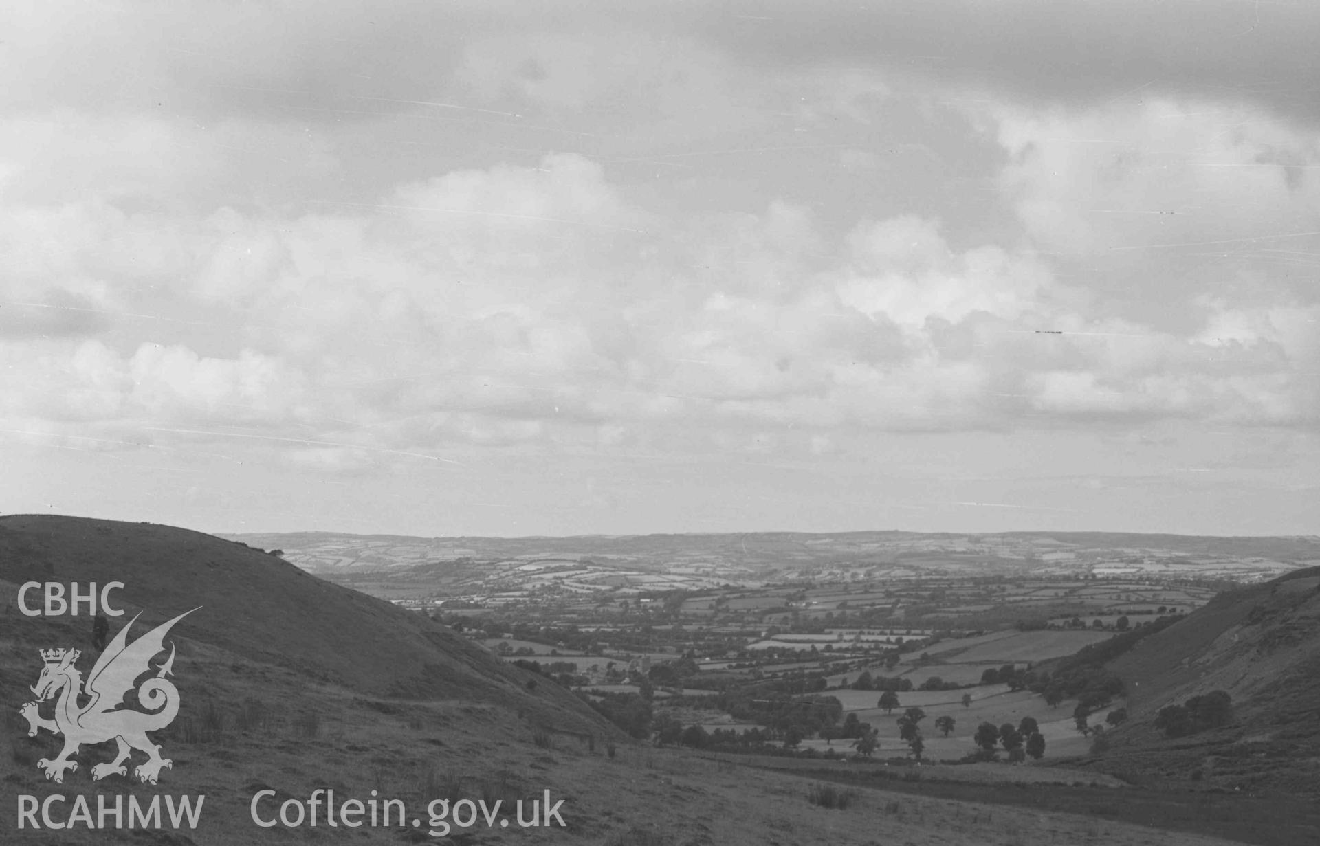 Digital copy of a black and white negative showing Llanddewi-Brefi from the Rhysgog mine. Photographed by Arthur Chater on 23 August 1969. Looking north west from Grid Reference SN 6807 5380.