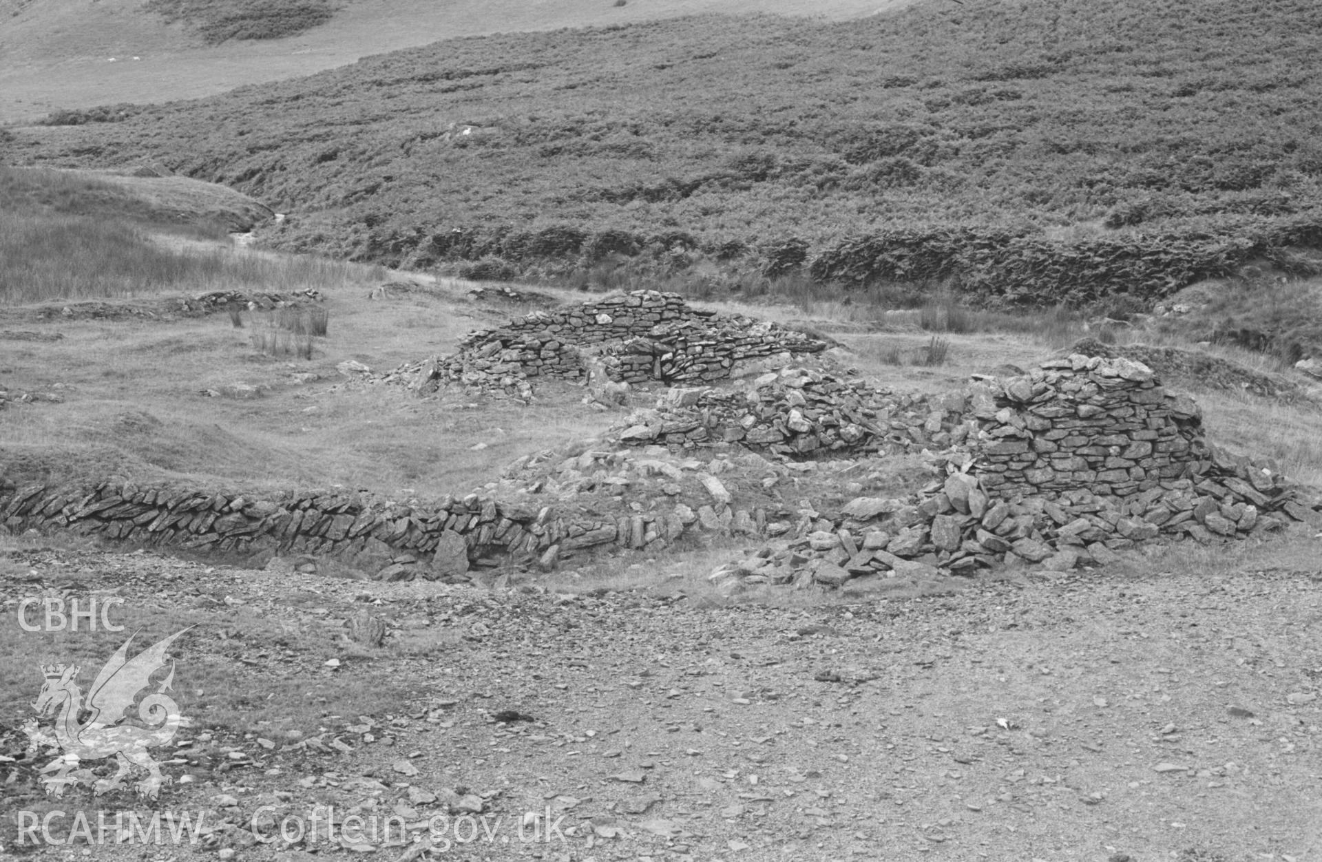 Digital copy of a black and white negative showing Rhysgog lead mine - ruins on lower part of mine, including dressing floors. Photographed by Arthur Chater on 23 August 1969. Looking north west from Grid Reference SN 6807 5380.