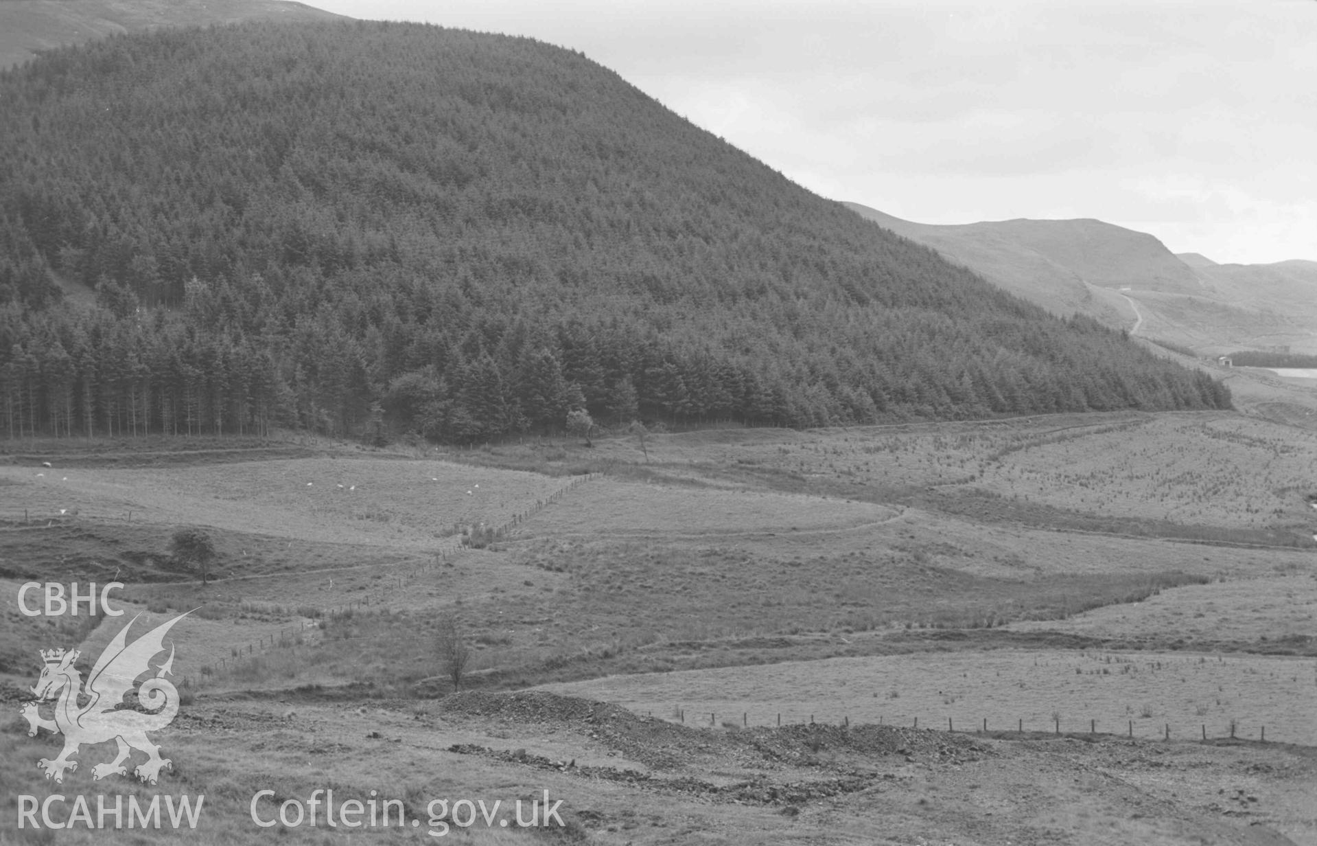 Digital copy of a black and white negative showing view down the Afon Castell from the lead mine, Llys-Arthur in centre; Gelli-Uchaf to the right. (Panorama, photograph 1 of 4). Photographed by Arthur Chater on 25 August 1969. Looking south west from Grid Reference SN 7912 8278.