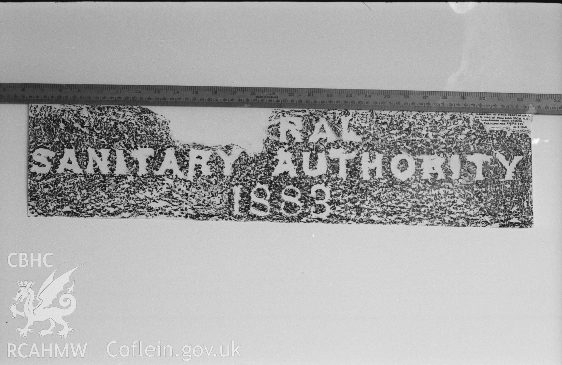 Digital copy of a black and white negative showing rubbing of plaque on drinking fountain, Llanbadarn Fawr. Produced by Arthur Chater on 26 August 1969.