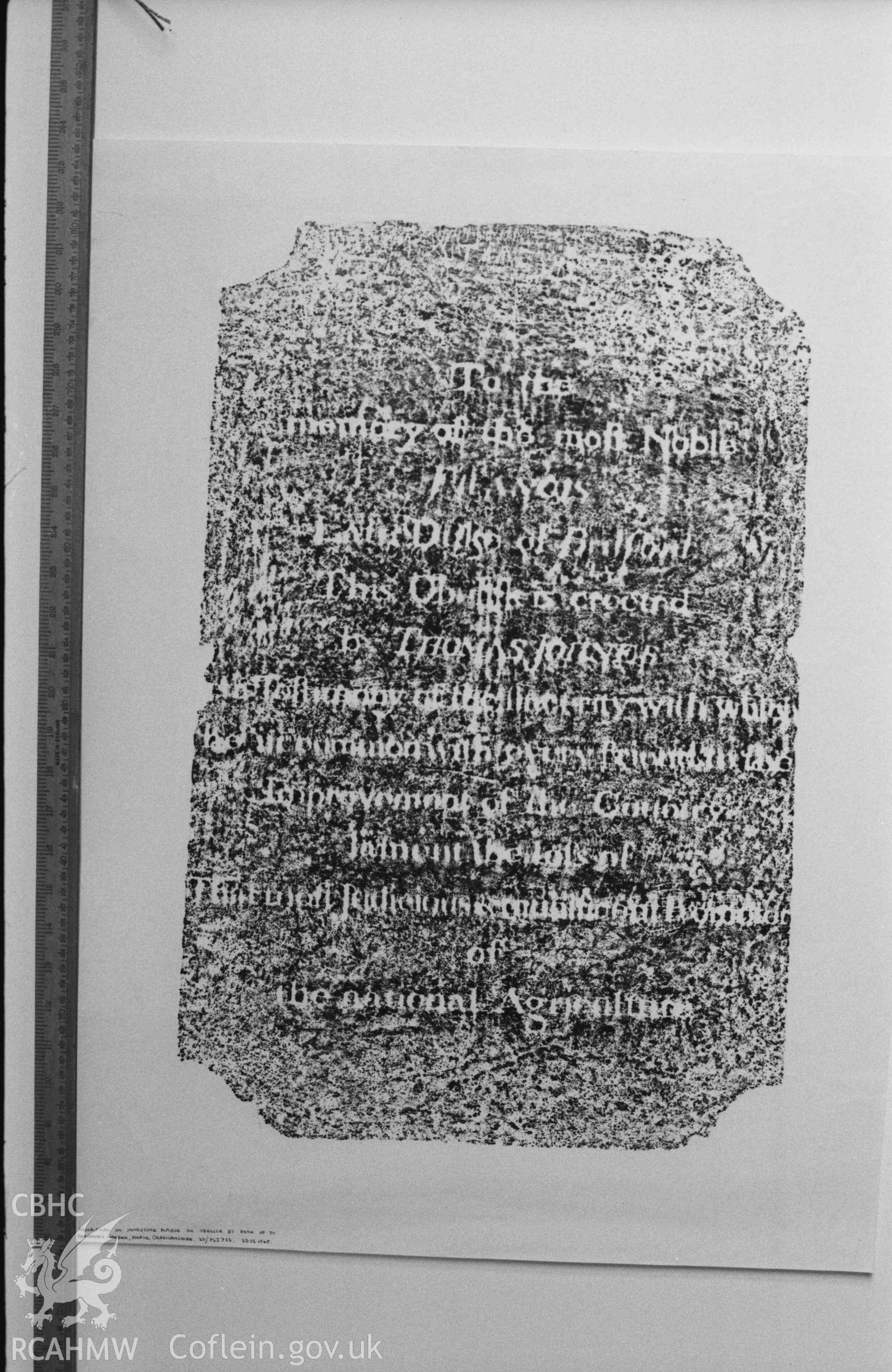 Digital copy of a black and white negative showing rubbing of inscription on sandstone plaque on obelisk by path up to Marianne's Garden, Hafod. Produced by Arthur Chater on 26 August 1969.