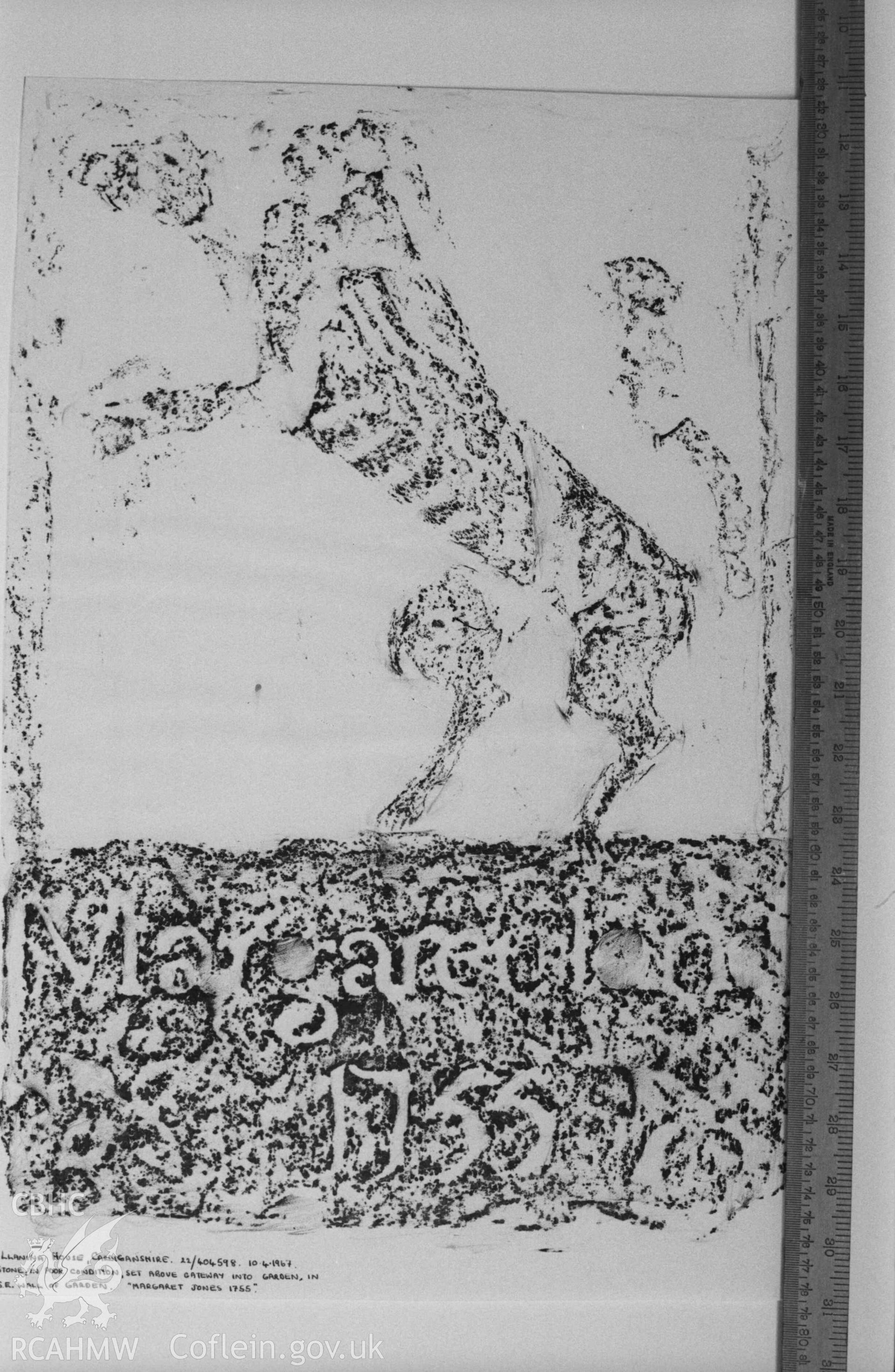Digital copy of a black and white negative showing rubbing of inscription onstone in poor condition set above gateway into garden at Llanina House. Produced by Arthur Chater on 26 August 1969.