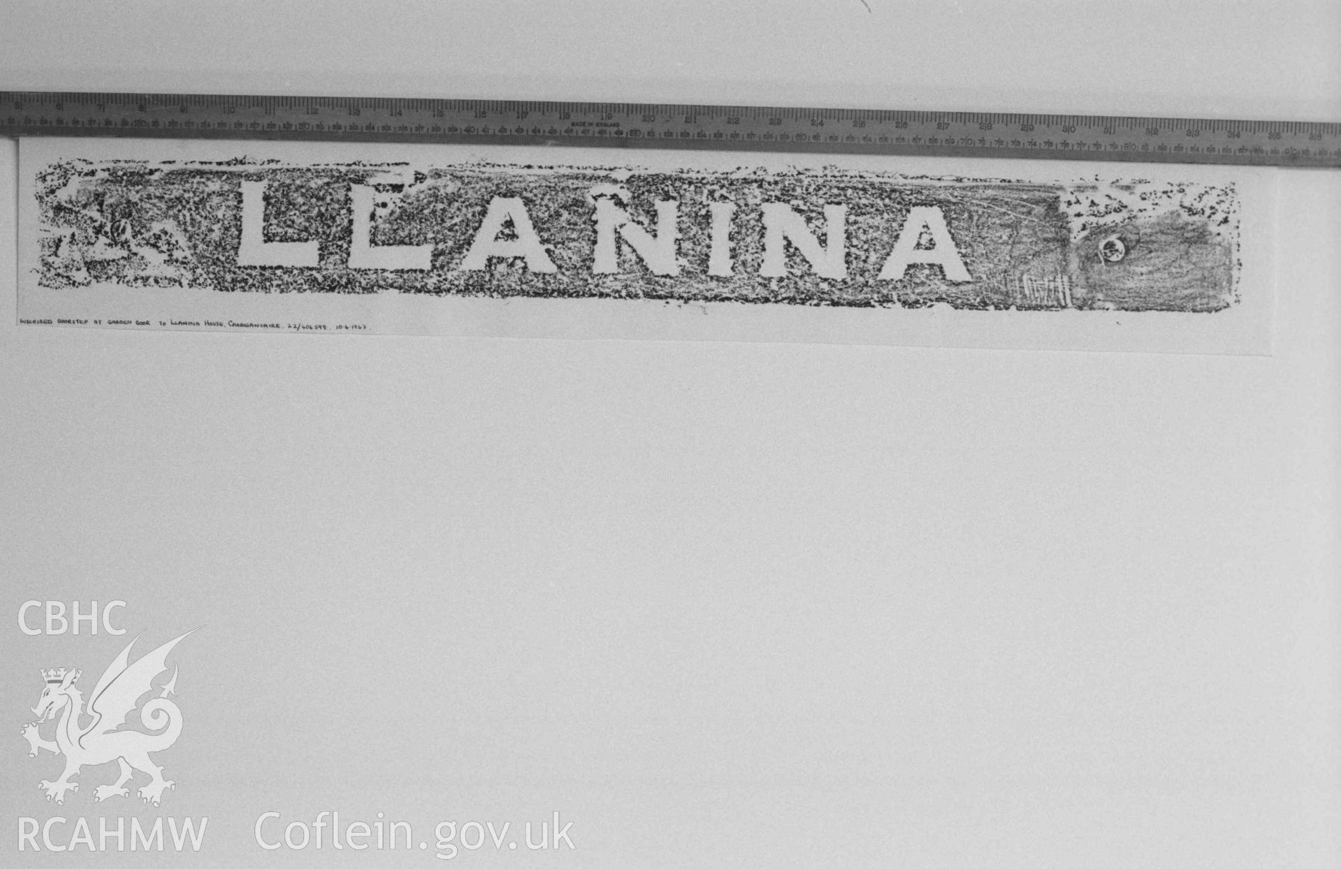 Digital copy of a black and white negative showing inscription on doorstep at garden door to Llanina House. Produced by Arthur Chater on 26 August 1969.