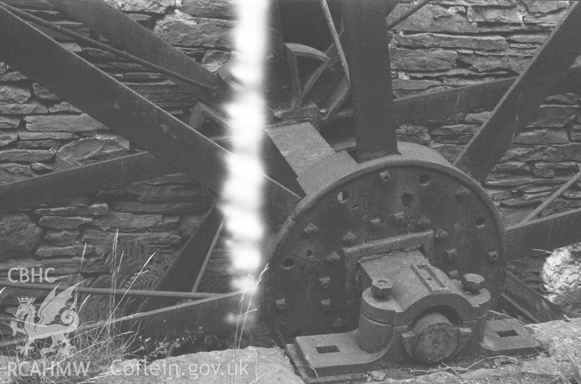 Digital copy of a black and white negative showing detailed view of spokes of iron overshot wheel of Melin y Bont-Goch. Photographed by Arthur Chater on 27 August 1969, from Grid Reference SN 6833 8629.