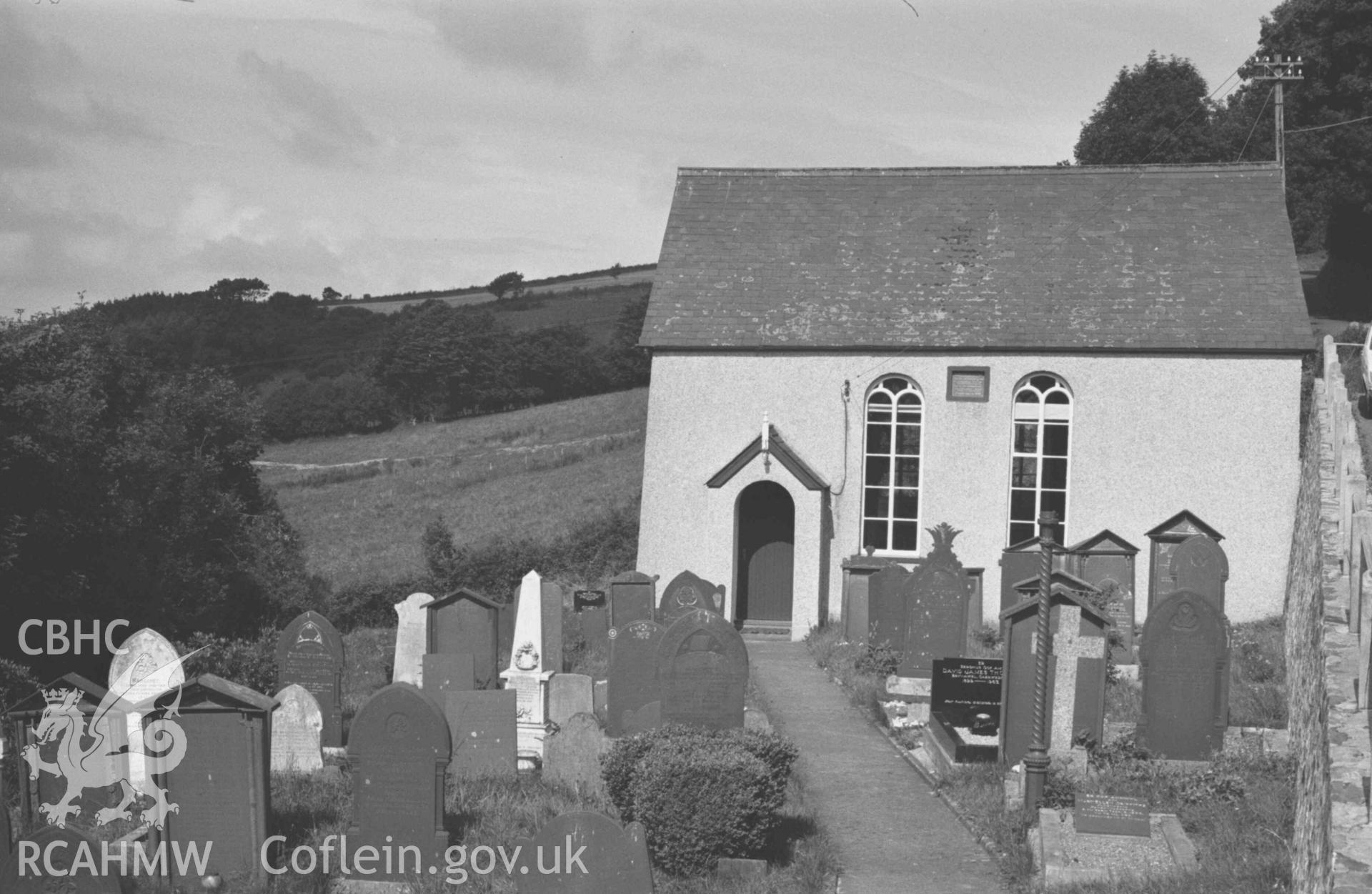 Digital copy of a black and white negative showing Capel Llwyndafydd (Baptist) from the graveyard. Photographed by Arthur Chater on 28 August 1969, looking north west from Grid Reference SN 3705 5558.