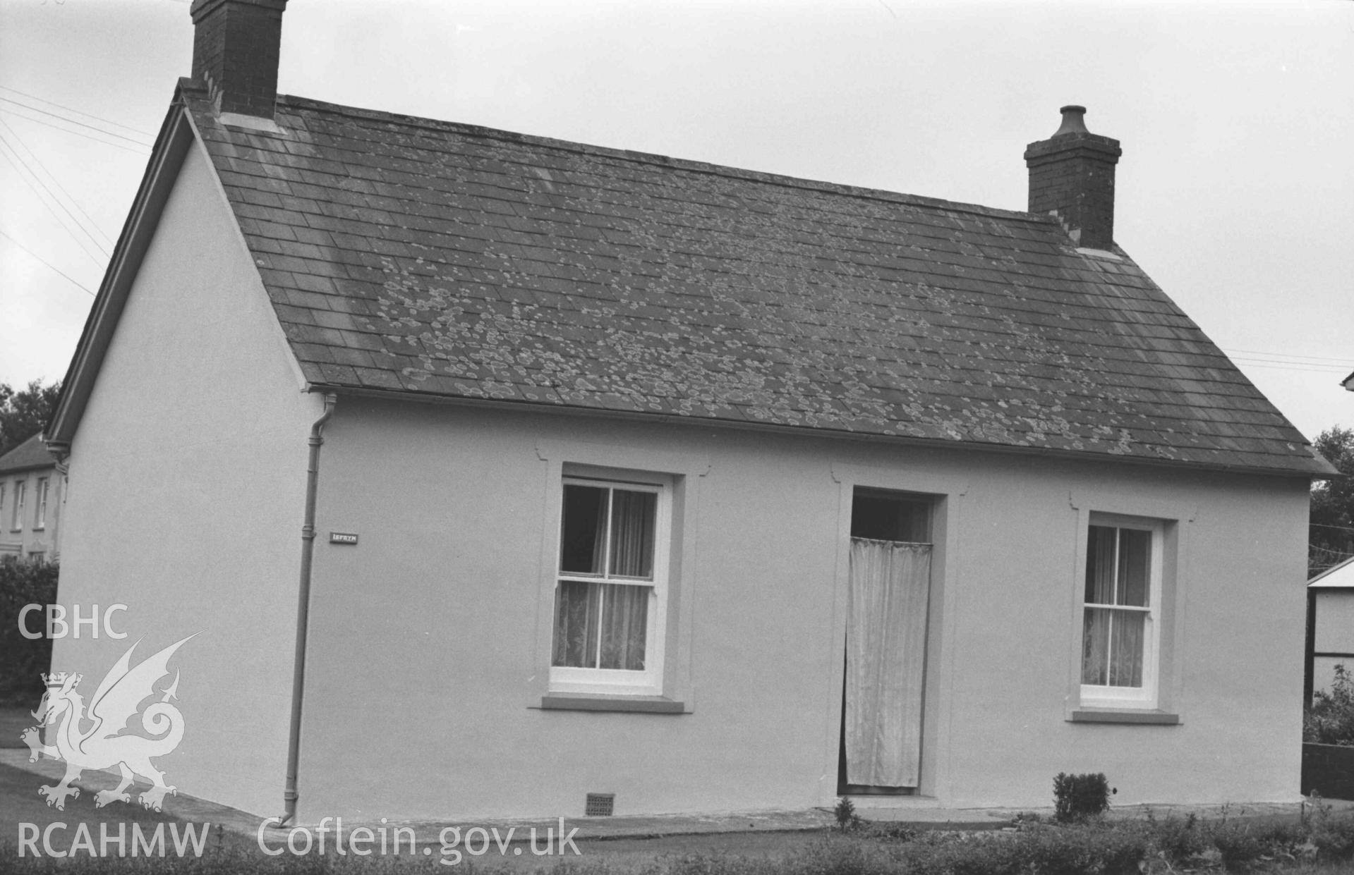 Digital copy of a black and white negative showing Isfryn (the old Capel Gwndwn converted into a dwelling house) on the south east corner of the crossroads. Photographed by Arthur Chater on 28 August 1969, looking south east from Grid Reference SN 3542 5197.