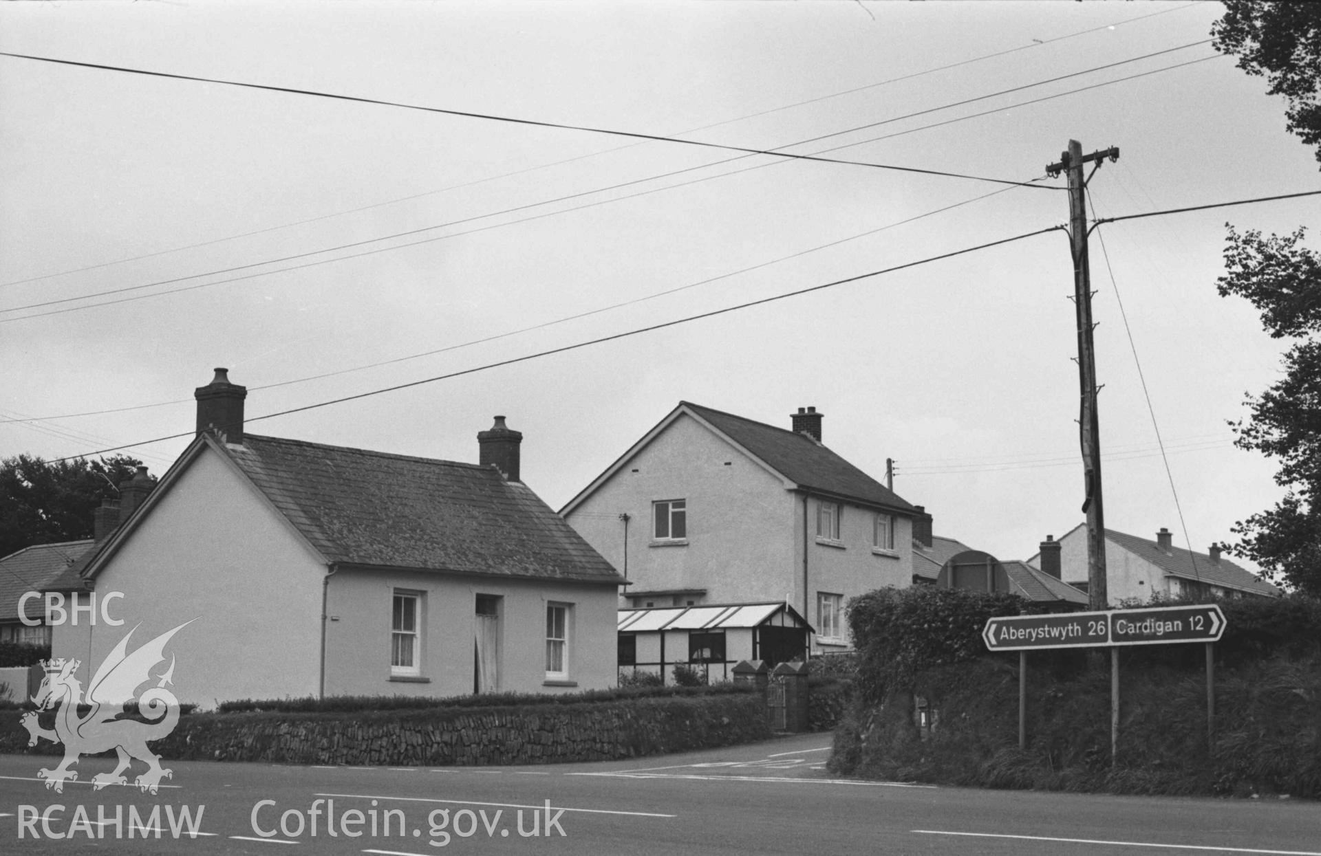 Digital copy of a black and white negative showing Isfryn (the old Capel Gwndwn converted into a dwelling house) on the south east corner of the crossroads. Photographed by Arthur Chater on 28 August 1969, looking south east from Grid Reference SN 3542 5197.