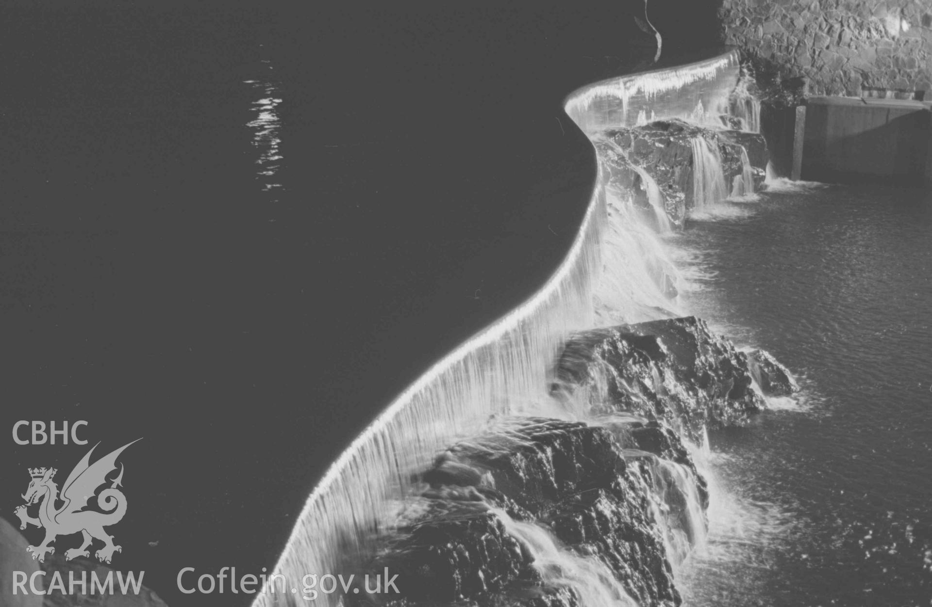 Digital copy of a black and white negative showing Cwm Rheidol (Aberffrwd) weir and the Poacher floodlit. 10pm. Photographed by Arthur Chater on 28 August 1969, looking south south east from Grid Reference SN 6927 7941.