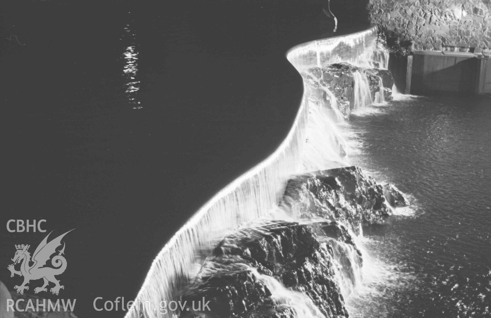 Digital copy of a black and white negative showing Cwm Rheidol (Aberffrwd) weir and the Poacher floodlit. 10pm. Photographed by Arthur Chater on 28 August 1969, looking south south east from Grid Reference SN 6927 7941.