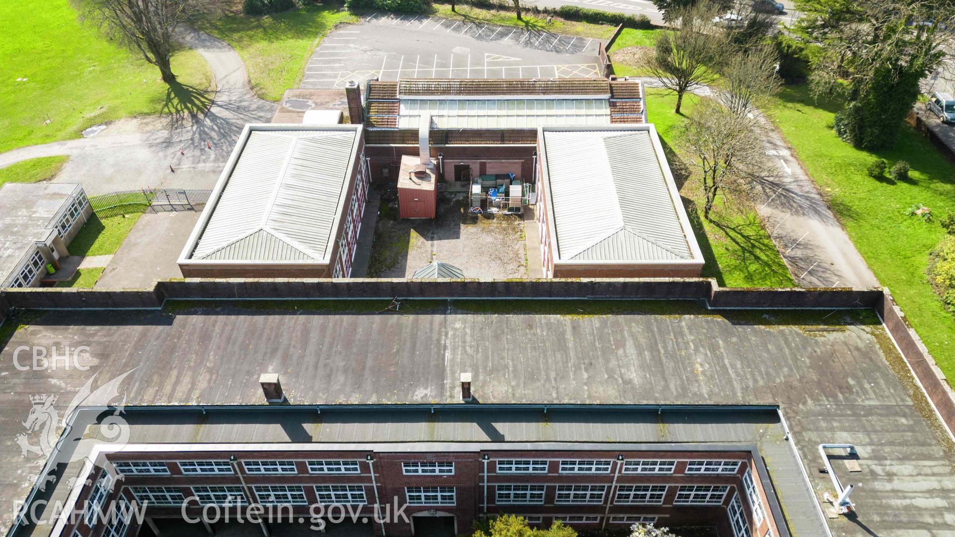 View west from centre of west quadrangle, showing separate boys and girls' gymnasiums and swimming pool. Bishop Gore School, Swansea.