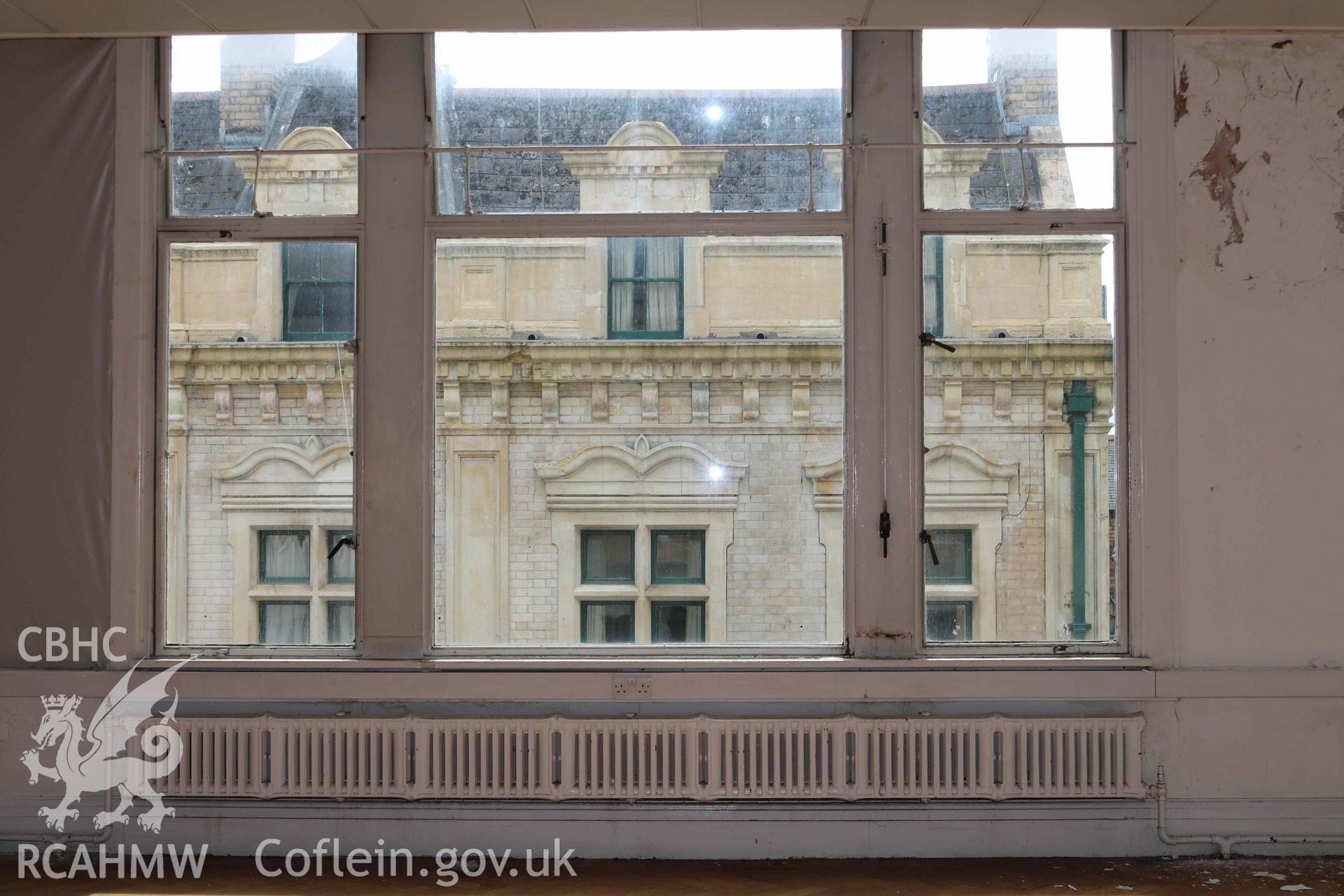 Photograph showing second floor hall - view from window, from a Level 4 Historic Building Record of the former Howells Department Store, Cardiff. Conducted as a part of listed building consent by Purcell Architecture in 2024.