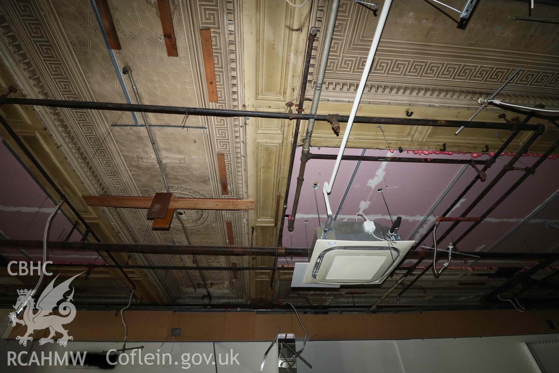 Photograph showing first floor shopfloor - ceiling detail, from a Level 4 Historic Building Record of the former Howells Department Store, Cardiff. Conducted as a part of listed building consent by Purcell Architecture in 2024.