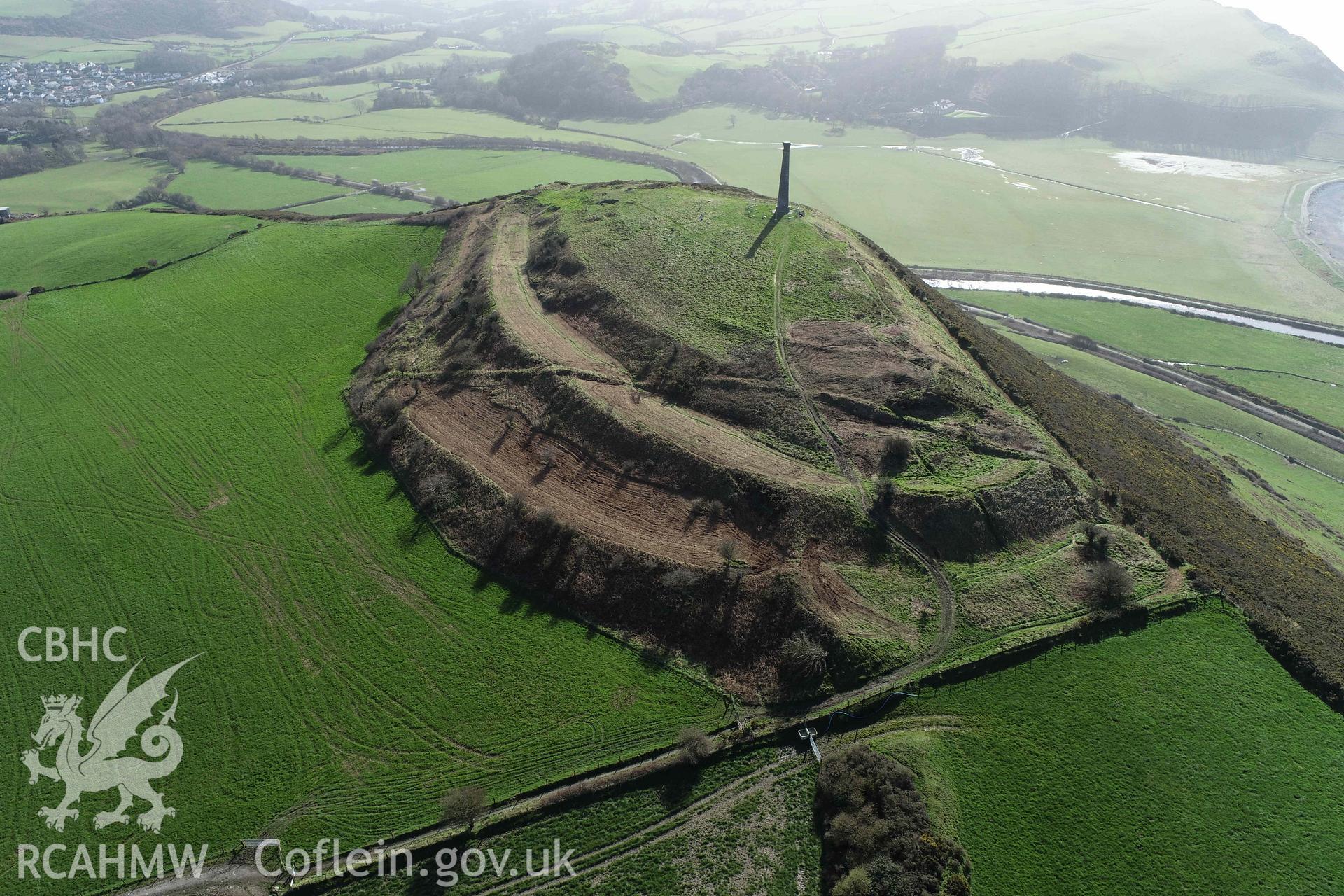 UAV image showing Pendinas South Fort from the north-east showing the areas cleared of bracken and gorse in March 2024.The image was used as an illustration in the publication 'Discovering Pendinas Hillfort, Penparcau, Aberystwyth'. From a UAV Photographic survey of Pendinas Hillfort, produced by Dr Toby Driver of RCAHMW in 2024.