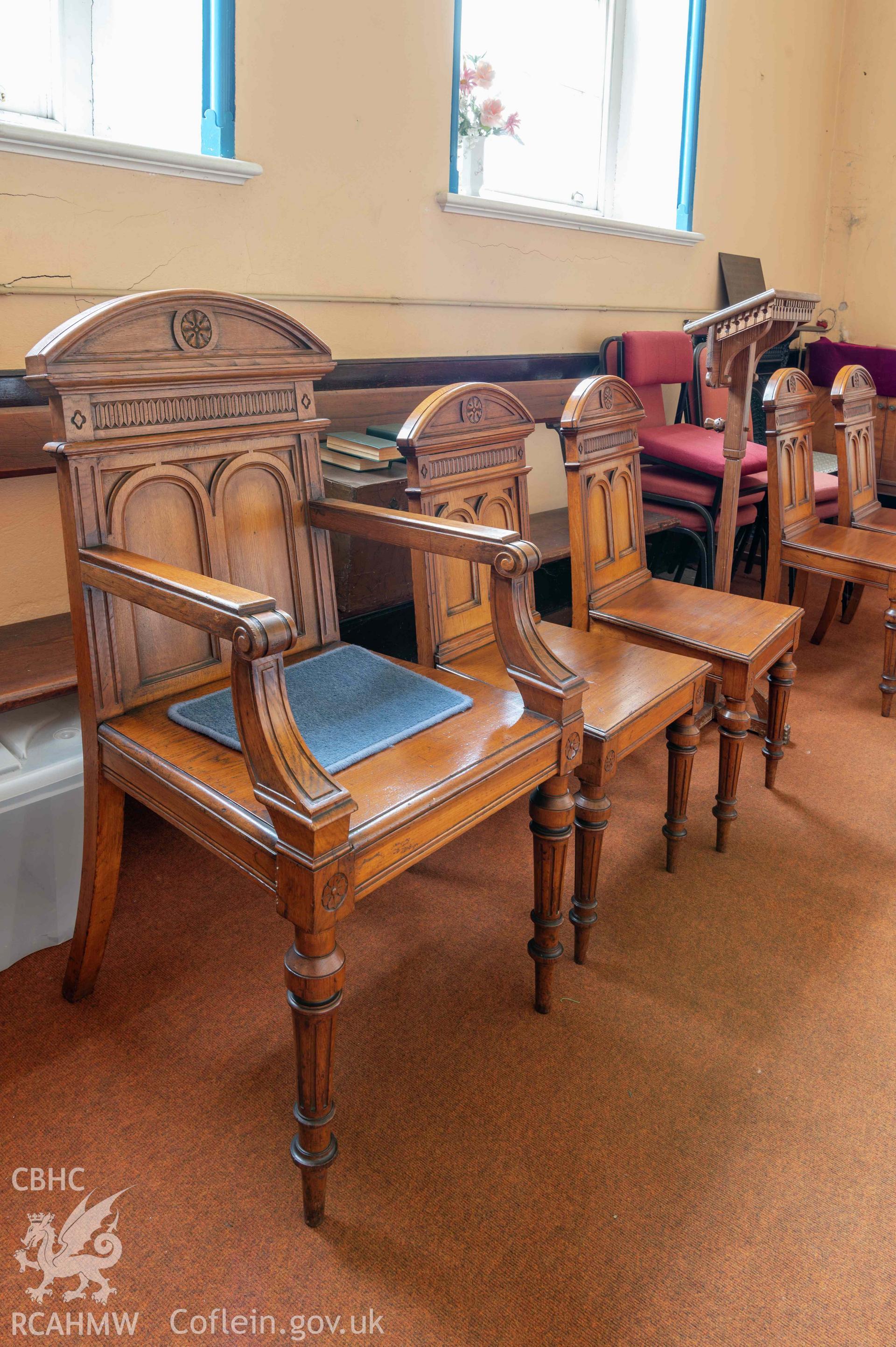Capel Zion Baptist Chapel, Newtown - ground floor, north-central north room detail of Deacons chairs.