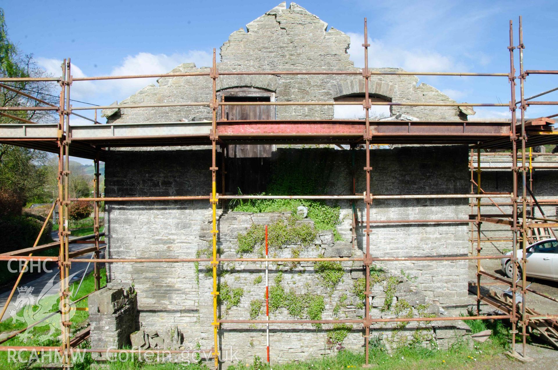 Photograph showing  East elevation of cartshed, from a Photographic Survey of outbuildings at Upper House Farm Evenjobb, submitted as part of Listed Building consent. Photograph taken by Christopher Welch in April/June 2024.