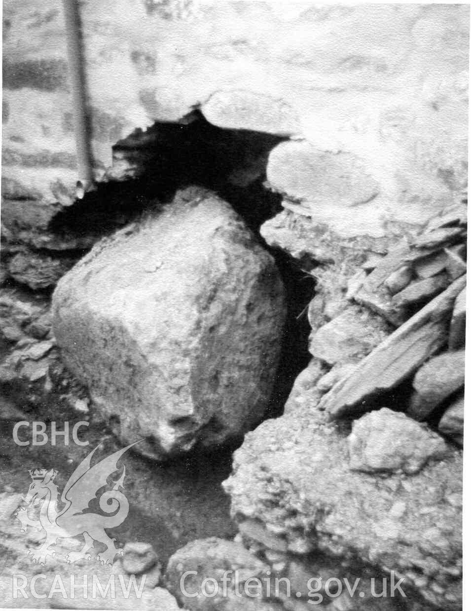 Groundwork for new bathroom (old dairy) drain outlet at Hafod Dwyryd hits a boulder. Photographed by Ronald and Joan Adams in about 1964.