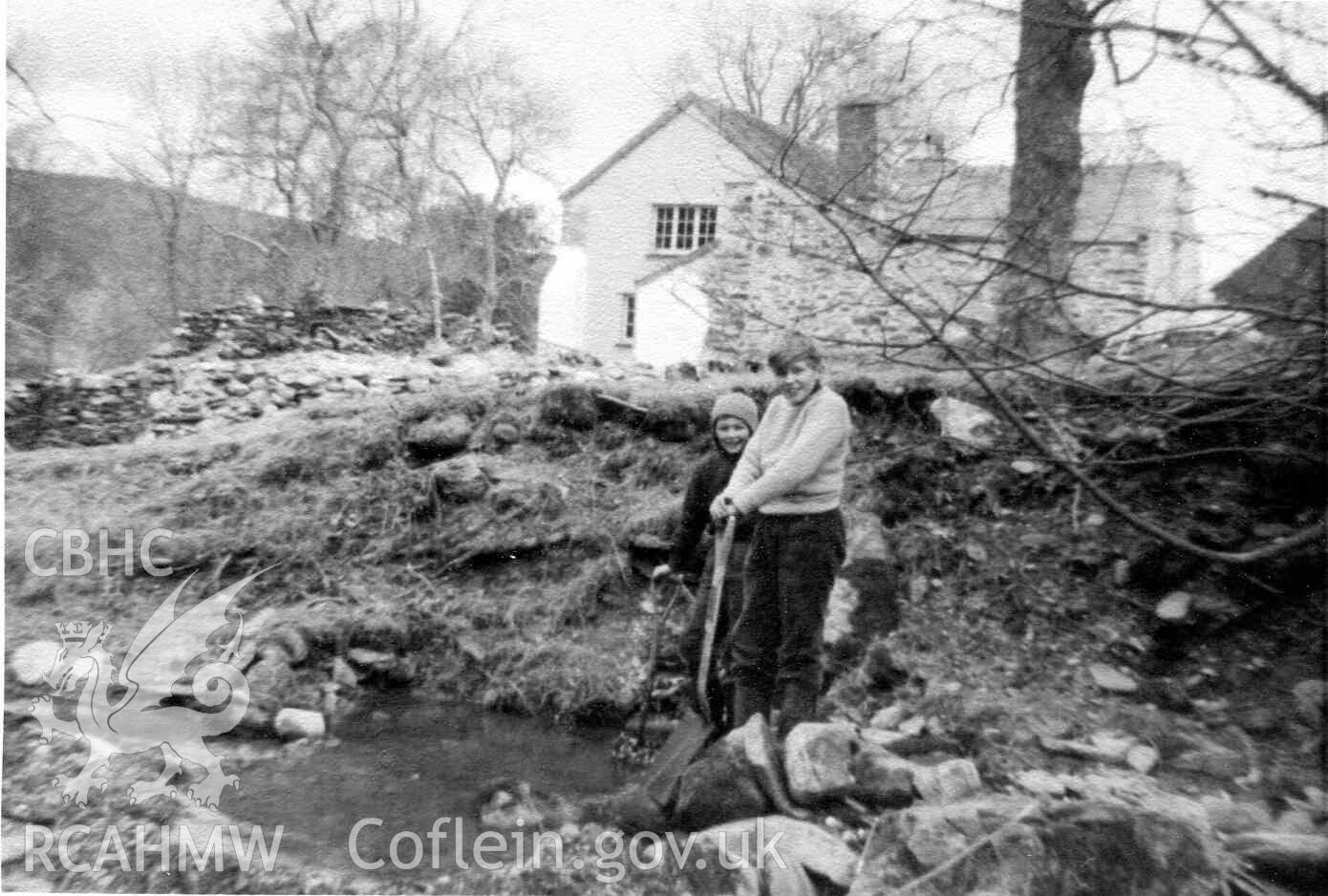 Keith and Michael Adams in front of Hafod Dwyryd, during renovation work. Photographed by Ronald and Joan Adams in about 1964 or 1965.