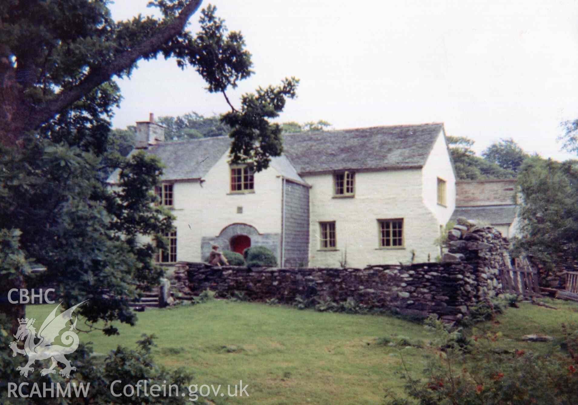 Keith Adams sitting in front of Hafod Dwyryd house. Photographed by Ronald and Joan Adams in the late 1960s.