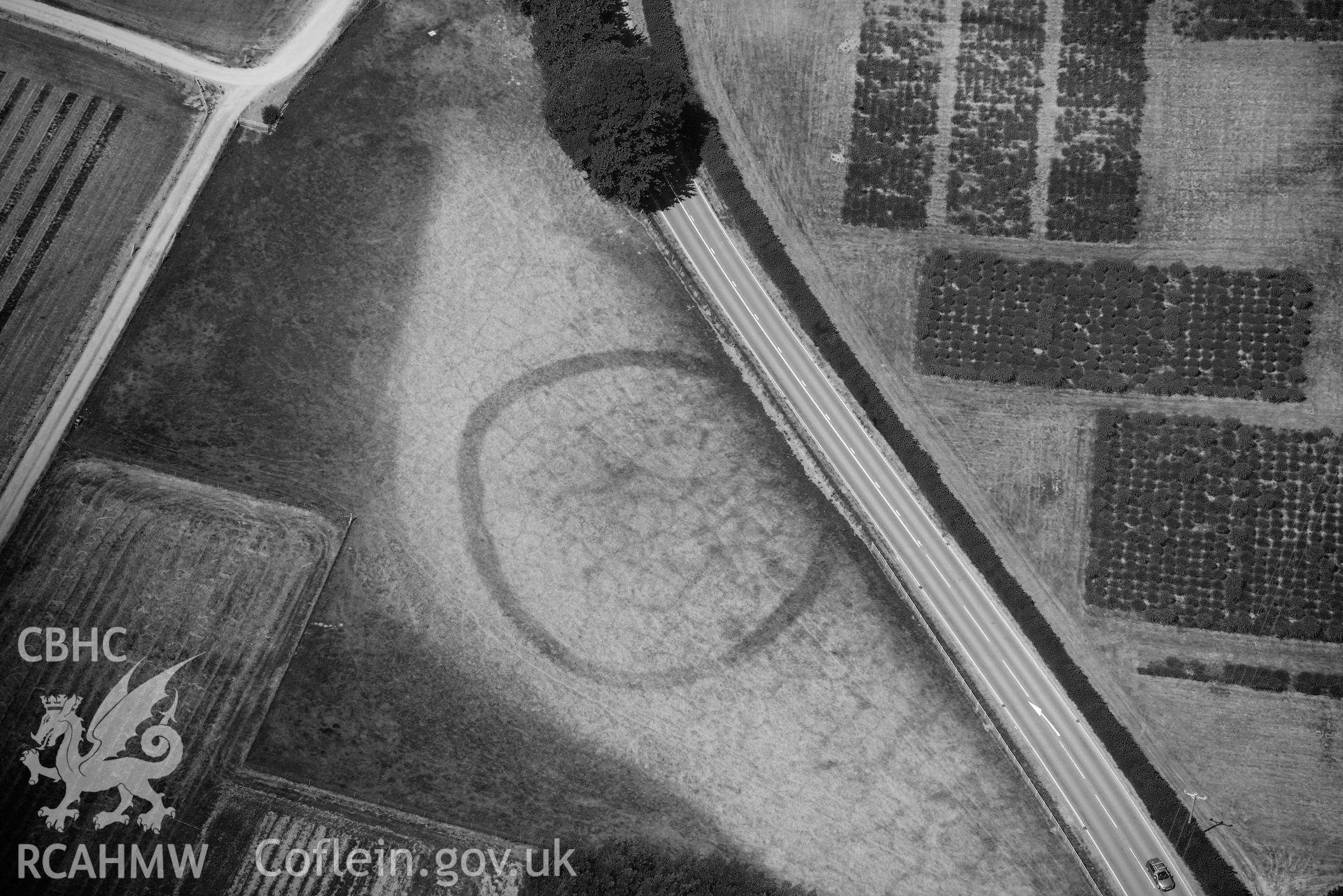 Gogerddan enclosure. Oblique black and white aerial photograph taken during the Royal Commission’s programme of archaeological aerial reconnaissance by Toby Driver on 10 July 2018.