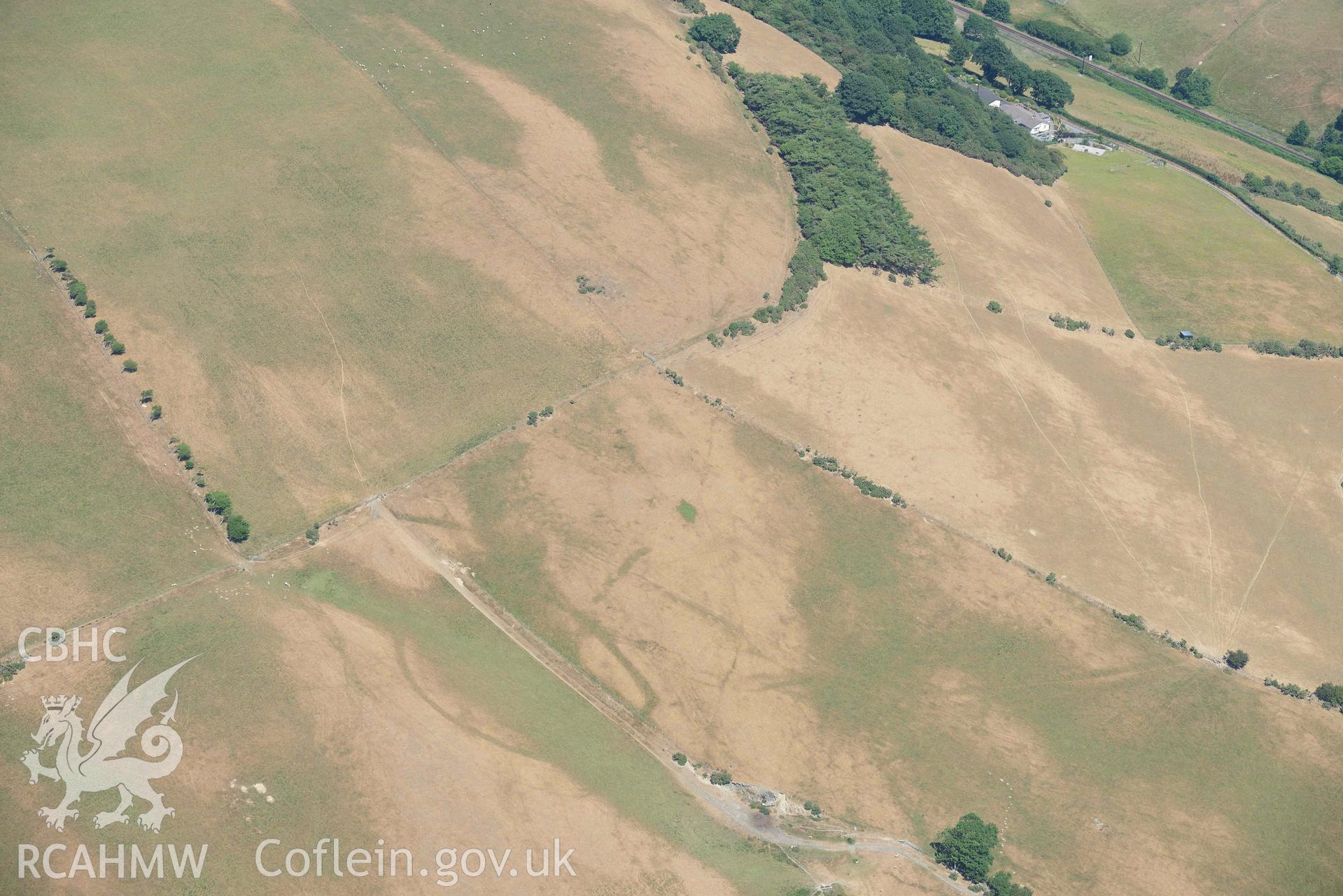 Ruel Uchaf enclosure. Oblique aerial photograph taken during the Royal Commission’s programme of archaeological aerial reconnaissance by Toby Driver on 10 July 2018.